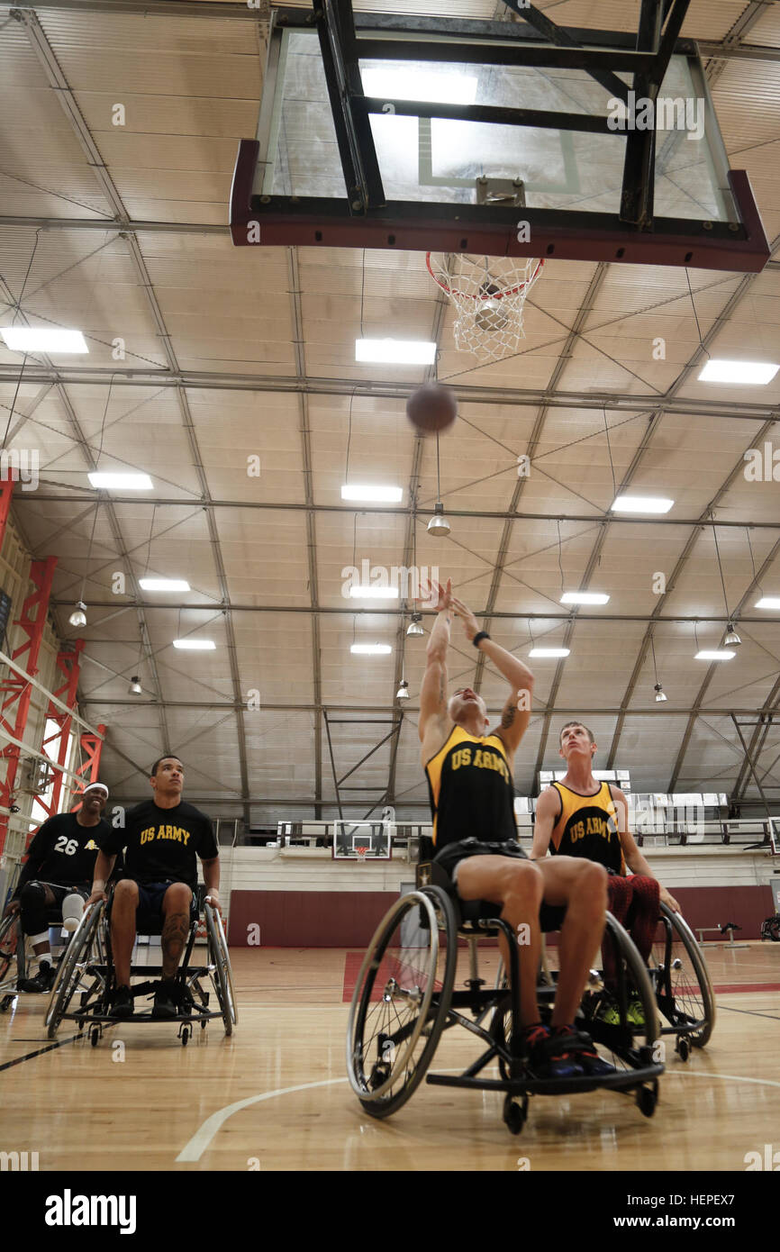 U.S. Army athletes, practice basketball drills during training for the 2015 Department of Defense Warrior Games at Fort Belvoir, Va., June 13, 2015. More than 40 active duty and veteran athletes train at Fort Belvoir to represent Team Army in the DOD Warrior Games held at Marine Corps Base Quantico, Va., June 19-28. The 2015 DOD Warrior Games is an adaptive sports competition for wounded, ill and injured service members and veterans. Approximately 250 athletes, representing teams from the Army, Marine Corps, Navy, Air Force, Special Operations Command and the British Armed Forces will compete  Stock Photo