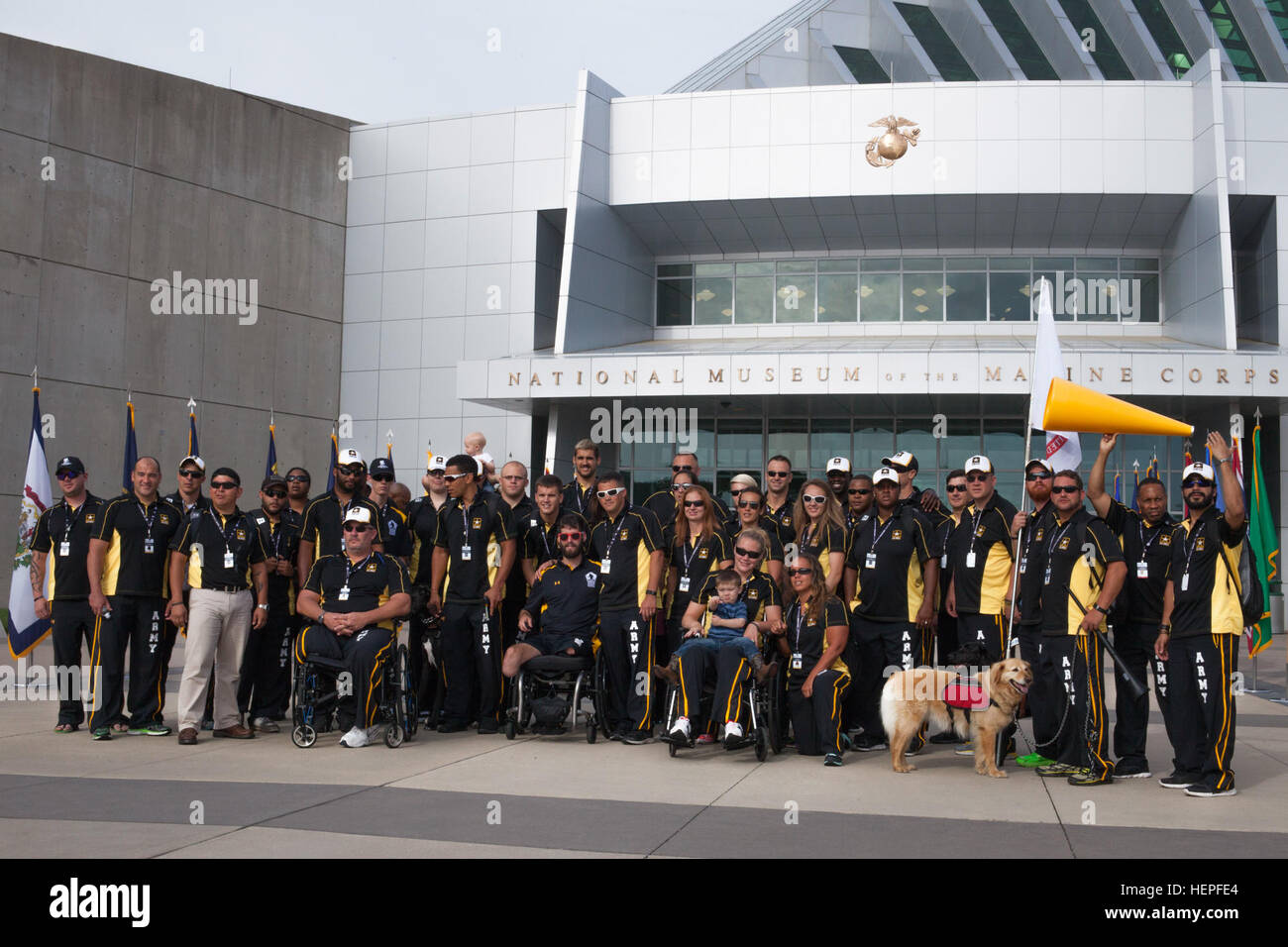 U.S. Army veteran and active duty athletes pose for a group photo before the opening ceremony for the 2015 Department of Defense Warrior Games at the National Museum of the Marine Corps, Triangle, Virginia. The 2015 DOD Warrior Games are held at Marine Corps Base, Quantico, Virginia, June 19-28. The 2015 DOD Warrior Games is an adaptive sports competition for wounded, ill and injured service members and veterans. Approximately 250 athletes, representing teams from the Army, Marine Corps, Navy, Air Force, Special Operations Command and the British Armed Forces will compete in archery, cycling,  Stock Photo