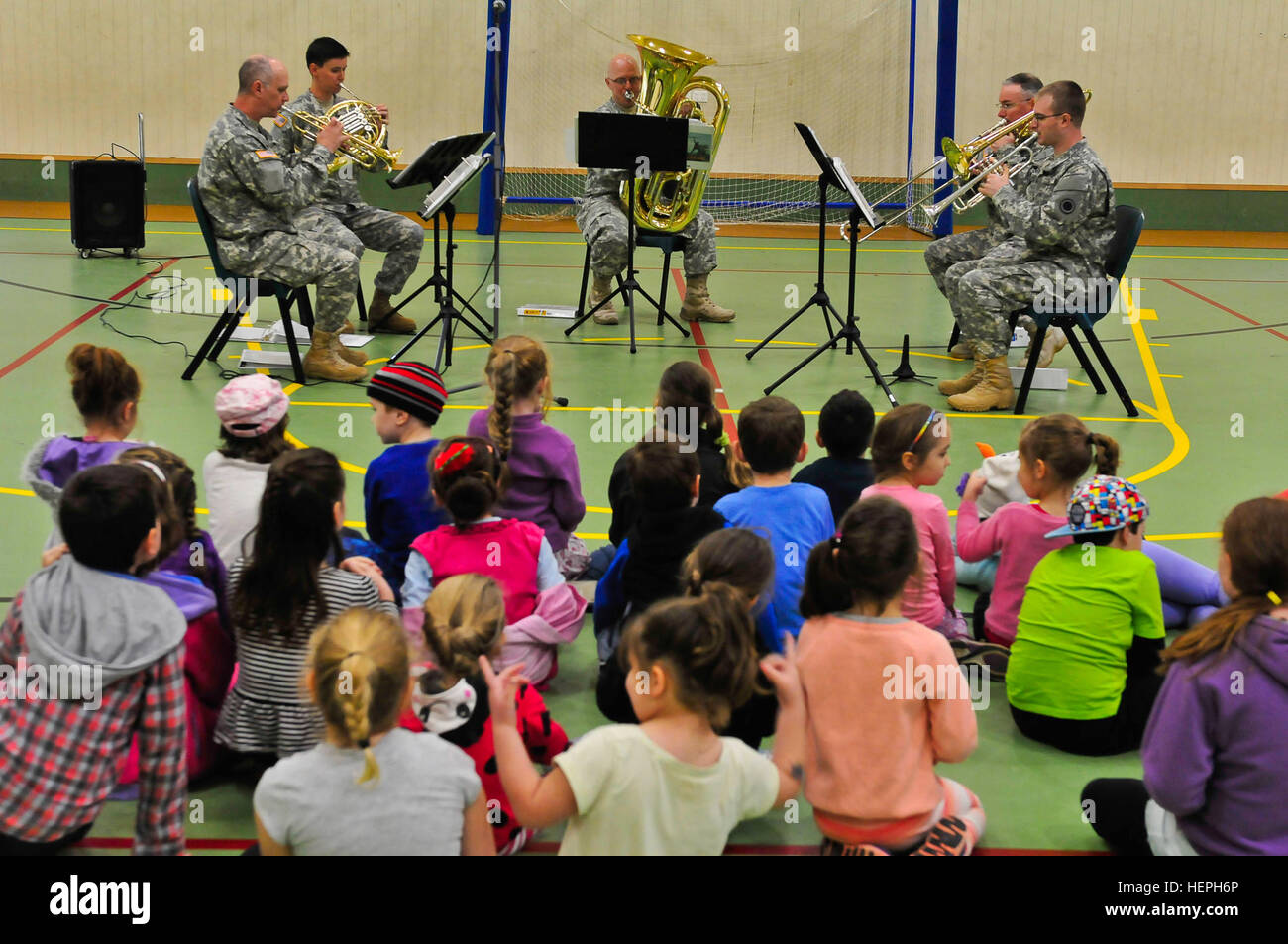 Soldiers from the 56th Army Band, I Corps, perform various songs highlighting how each instrument sounds in the brass quintet for children in a stay safe summer program at the Police Citizens Youth Club in Nambour, Australia, July 10. 56th Army Band provides musical education for Australian youth 150710-A-UG106-354 Stock Photo