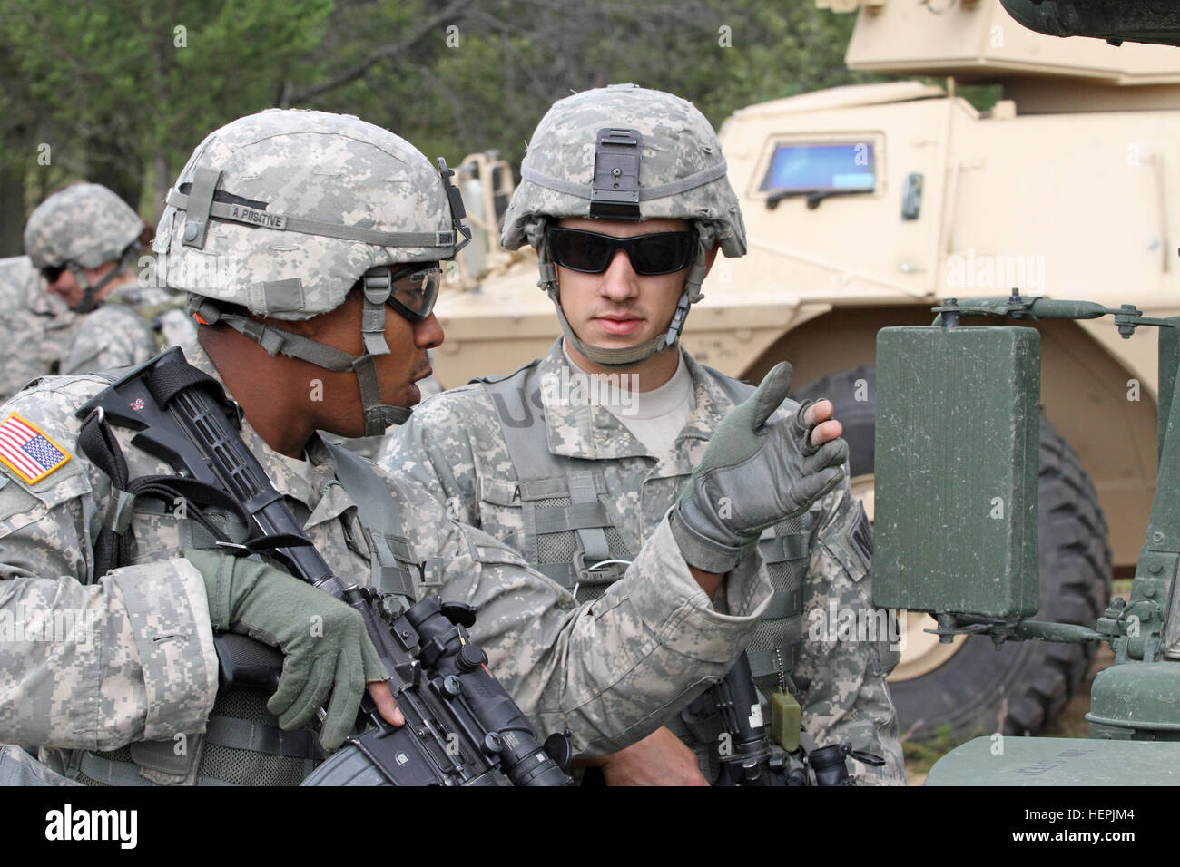 U.S. Army Sgt. Ahmad Brown, left, 32nd Military Police Company, 157th ...