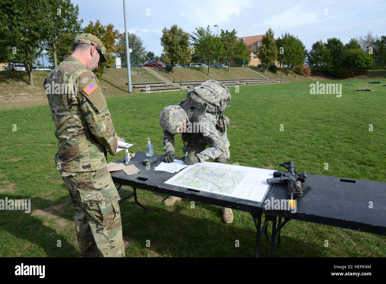 U.S. troopers with 2nd Cavalry Regiment locate an unknown point on a map while training for the 2nd CR Expert Infantryman Badge (EIB) qualification at the 7th Army Joint Multinational Training Command’s Vilseck Training Area, Germany, Sept. 16, 2015. (U.S. Army photo by VI Specialist Matthias Fruth/Released) 2nd Cavalry Regiment Expert Infantryman Badge 2015 150916-A-FS311-003 Stock Photo
