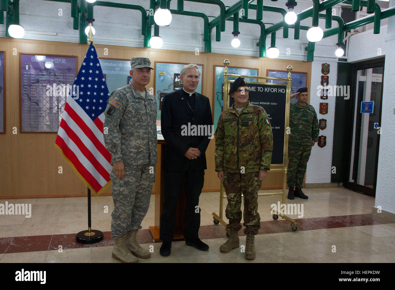 U.S. Army Brig. Gen. Janson D. Boyles (left), the Kosovo Force Chief of Staff, Bishop Richard Spencer (center), from the Archdiocese for the Military Services, USA, and Italian Maj. Gen. Guglielmo Luigi Miglietta (right), the KFOR Commander, pose for a group photo during Spencer’s Oct. 7, 2015, religious support visit to the KFOR headquarters at Camp Film City in Pristina, Kosovo. Spencer met with the leaders to discuss religious support topics important to the command. Spencer, a retired Army colonel and chaplain, is the Episcopal Vicar for Europe and Asia, responsible for providing religious Stock Photo