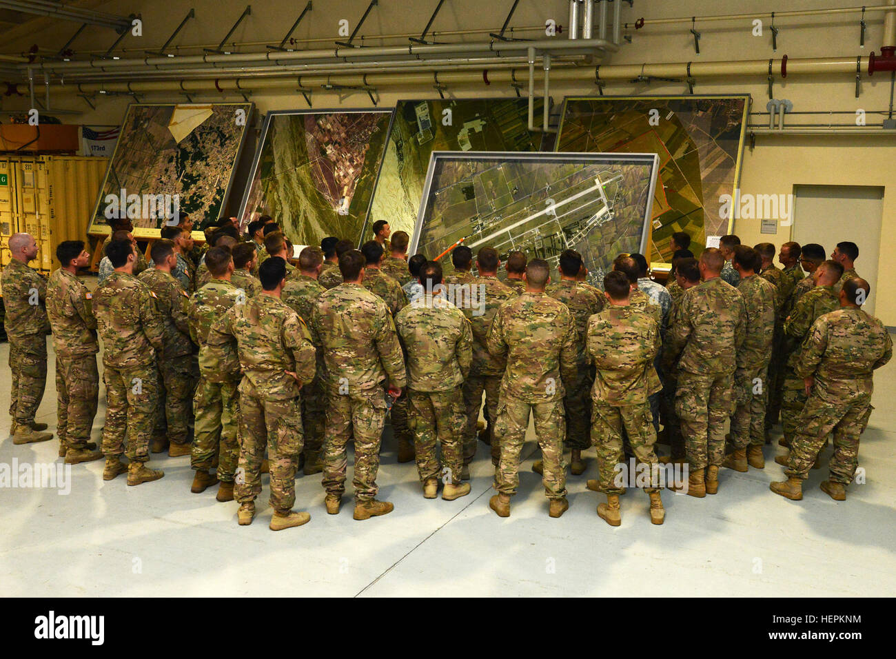 U.S. paratroopers assigned to the 2nd Battalion, 503rd Infantry Regiment, 173rd Airborne Brigade, review drop zone area map at Aviano Air Base, for an airborne operation on Rivolto Air Base, Italy, Oct. 28, 2015. The 173rd Airborne Brigade is the Army Contingency Response Force in Europe, capable of projecting ready forces anywhere in the U.S. European, Africa or Central Commands areas of responsibility within 18 hours. (U.S. Army photo by Visual Information Specialist Paolo Bovo/Released) Airborne Operation at Rivolto Air Base, Italy 151028-A-JM436-077 Stock Photo