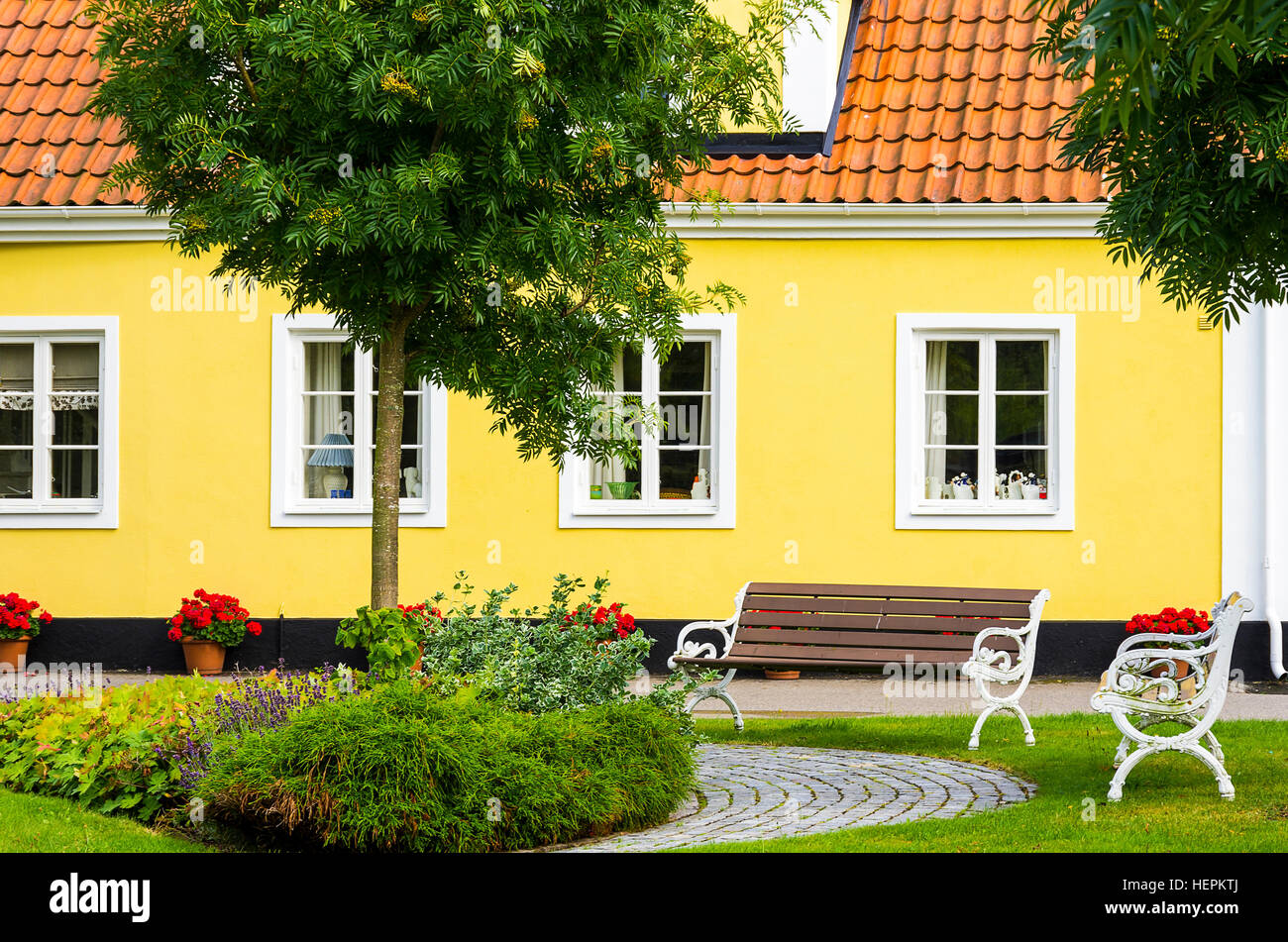 Yellow residential town house in Viken, Skane County, Sweden. Stock Photo