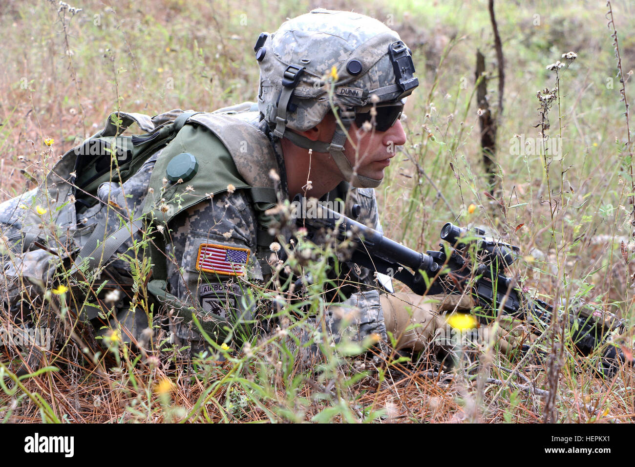 A Soldier assigned to 2nd Battalion, 7th Cavalry Regiment, 3rd Armored Brigade Combat Team, 1st Cavalry Division defends a position just outside of Tofani, Atropia, a scenario based town during Joint Readiness Center rotation 16-02 at Fort Polk, La., Nov. 5, 2015. Soldiers from 1st CAV are supporting 1st Brigade Combat Team, 82nd Airborne Division in their train up for the assumption of the Global Response Force. 2nd Battalion, 7th CAV Regiment trains at JRTC 151105-A-ZR634-037 Stock Photo