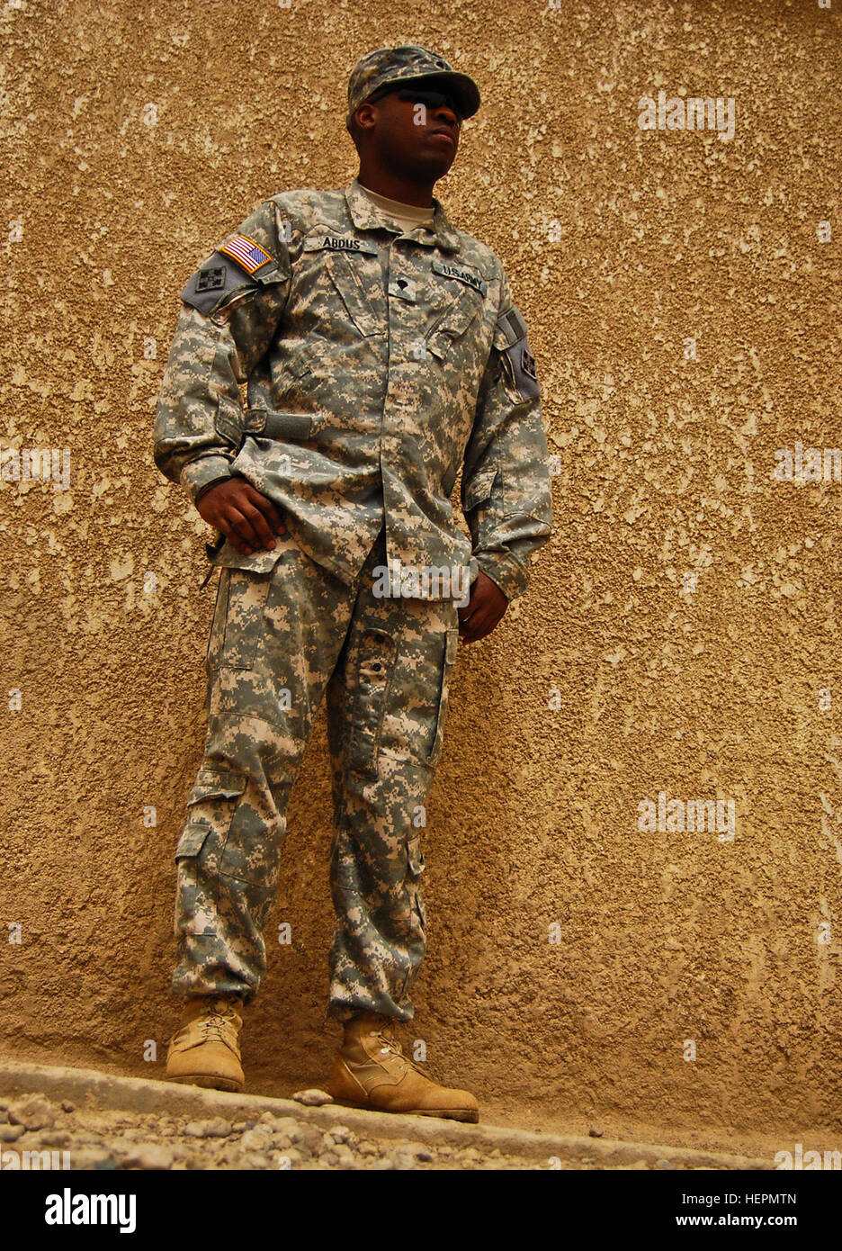 CAMP TAJI, Iraq--Spc. Damone Abdus Salaam, paralegal specialist, Headquarters and Headquarters Company, Combat Aviation Brigade, 4th Infantry Division, Multi - National Division - Baghdad, stands outside his office building during a break from work Sept. 10. Seven years after the terrorist attacks on the World Trade Center Sept. 11,  2001, Adbus, originally from New York City, still vividly remembers the horrific events that eventually spurred today's Global War on Terrorism. (U.S. Army photo by Sgt. Jason Dangel, CAB PAO, 4th Inf. Div., MND-B) Iron Eagle Soldier remembers firsthand account of Stock Photo