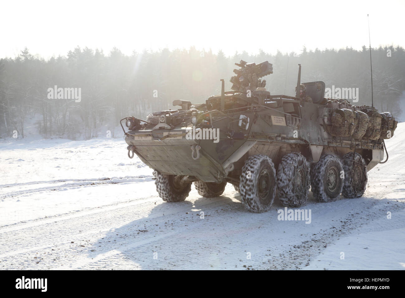 An M113 Armored Personnel Carrier of 2nd Squadron, 2nd Cavalry Regiment, maneuvers toward its objective while conducting a vehicle recovery operation during exercise Allied Spirit IV at the U.S. Army’s Joint Multinational Readiness Center in Hohenfels Training Area, Germany, Jan. 21, 2016. Exercise Allied Spirit IV is a U.S. Army Europe-directed, 7th Army Joint Multinational Training Command-conducted multinational exercise that is designed to prepare forces in Europe to operate together by exercising tactical interoperability and testing secure communications within NATO Alliance members and  Stock Photo