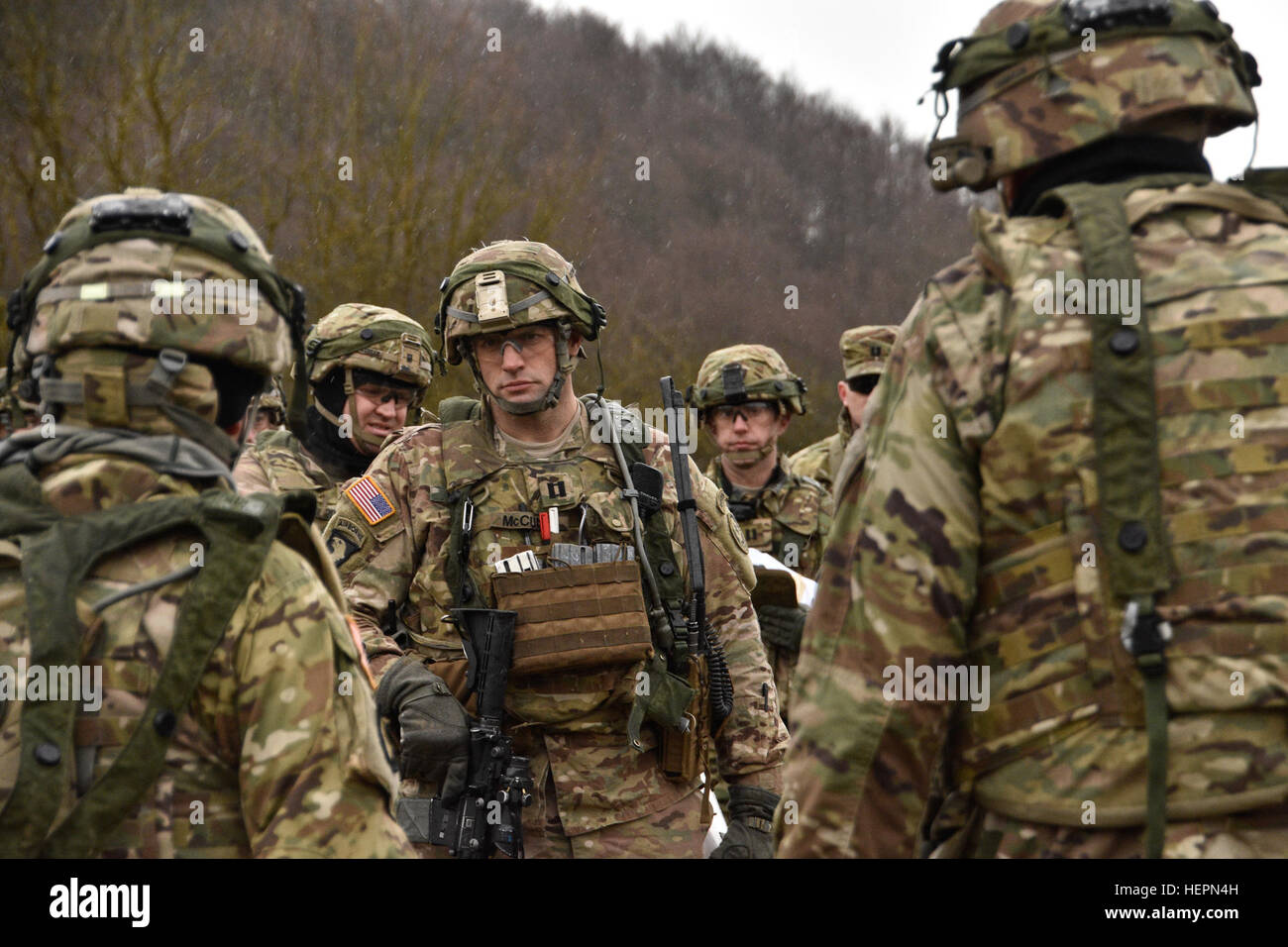Troopers and leaders assigned to 2nd Squadron (Cougars), 2nd Cavalry Regiment, listen as Lt. Col. Steven E. Gventer,  2nd Squadron Commander, points out the unit's position on a terrain map during a Combined Arms Rehearsal while participating in Exercise Allied Spirit IV, being held at the Joint Multinational Readiness Center located in Hohenfels, Germany, Jan. 28, 2016. The goal of the exercise is to prepare forces, in Europe, to operate together by exercising tactical interoperability and testing secure communications within NATO Alliance members and partner nations. (U.S. Army photo by Sgt. Stock Photo
