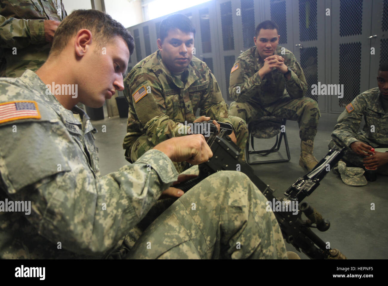 A Soldier of Company C, 3rd Battalion, 15th Infantry Regiment, 2nd Infantry Brigade Combat Team, 3rd Infantry Division, assembles an M240B machine gun Feb. 17, 2016, at Fort Stewart, Ga. The training is in preparation to earn the Expert Infantry Badge.  (U.S. Army photo by Spc. Corey Foreman / Released) Soldiers set sights on EIB 160217-A-XX999-0001 Stock Photo