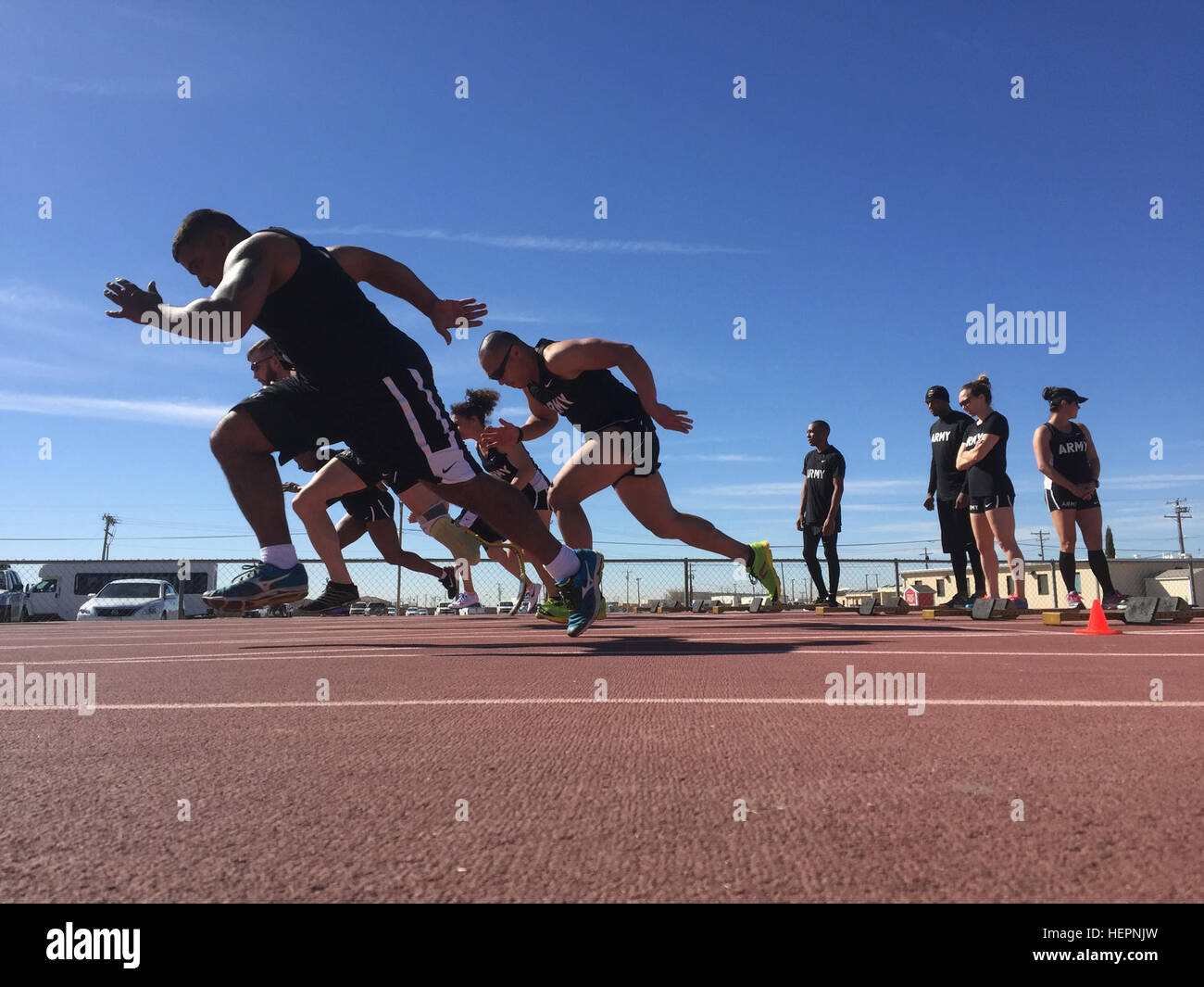 U.S. Army athletes practice block start drills at Stout Track, Fort