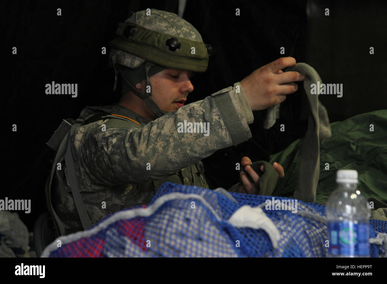 U.S. Army Spc. Joseph Roberson, a shower/laundry and clothing repair specialist assigned to the 1008th Quartermaster Company, folds clothes in support of the Combat Support Training Exercise (CSTX) “Arctic Lightning” at Joint Base McGuire-Dix-Lakehurst, N.J., March 13, 2016. The 1008th Quartermaster Company supports other units participating in the 21-day exercise by providing fresh laundry and hot showers at the various training sites. Fresh from the field 160313-A-FU473-113 Stock Photo