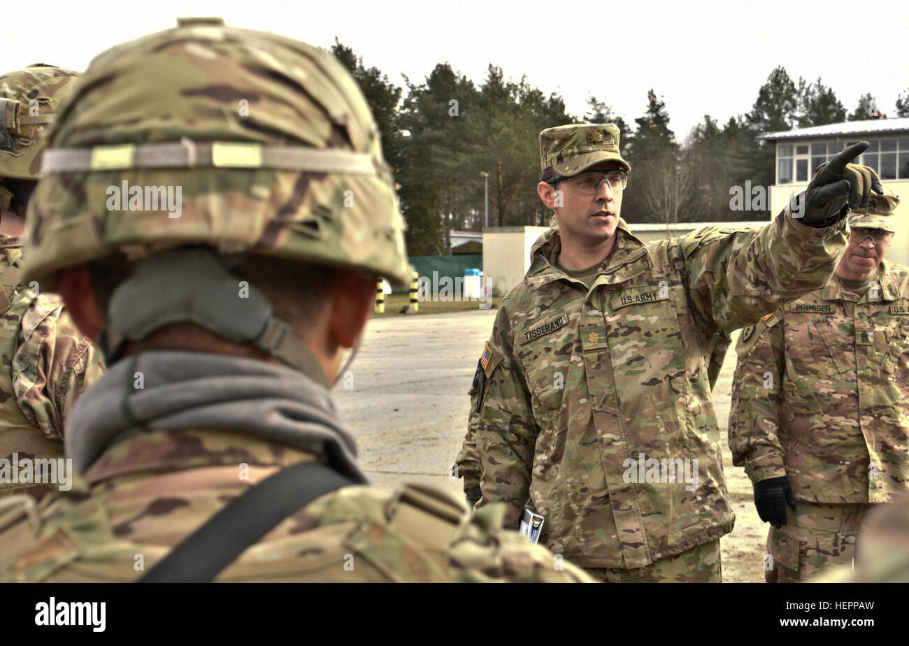 Maj. John C. Tisserand (right,) an operations officer assigned to 4th Squadron, 2nd Cavalry Regiment, provides his troopers with a range safety brief before they head out towards the range in their unit's M1134 Anti-Tank Guided Missile Vehicle during the squadron's live-fire exercise at the Grafenwoehr Training Area, located near Rose Barracks, Germany, March 15, 2016. The purpose of the live-fire exercise was to help validate the Regiment's Mission Command platforms while conducting  a capstone-training event that includes a transition from movement to maneuver capabilities. (U.S. Army photo  Stock Photo