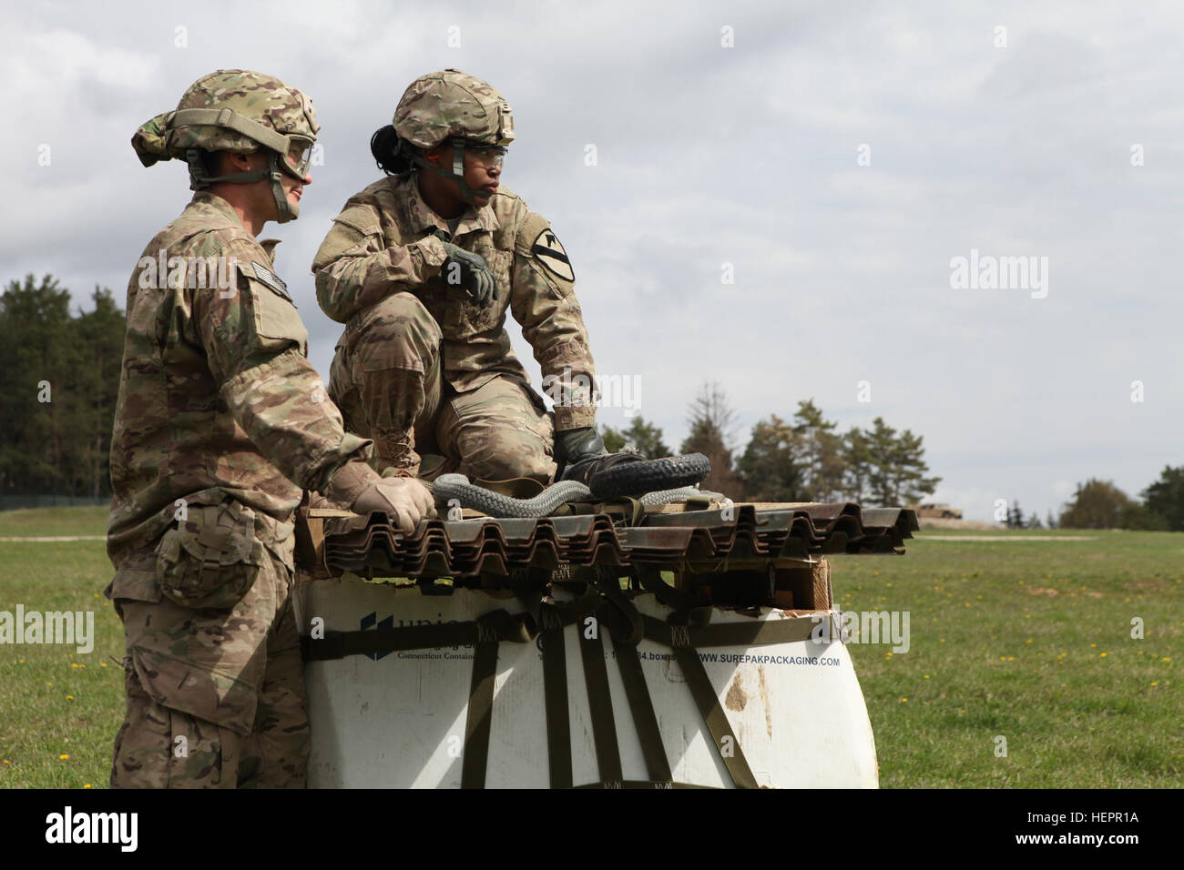 U.S. Soldiers of Charlie Company, 3rd Battalion, 227th Aviation Regiment 'Spearhead' observe an airstrip while conducting sling load operations during exercise Saber Junction 16 at the U.S. Army’s Joint Multinational Readiness Center (JMRC) in Hohenfels, Germany, April 13, 2016. Saber Junction 16 is the U.S. Army Europe’s 173rd Airborne Brigade’s combat training center certification exercise, taking place at the JMRC in Hohenfels, Germany, Mar. 31-Apr. 24, 2016.  The exercise is designed to evaluate the readiness of the Army’s Europe-based combat brigades to conduct unified land operations and Stock Photo