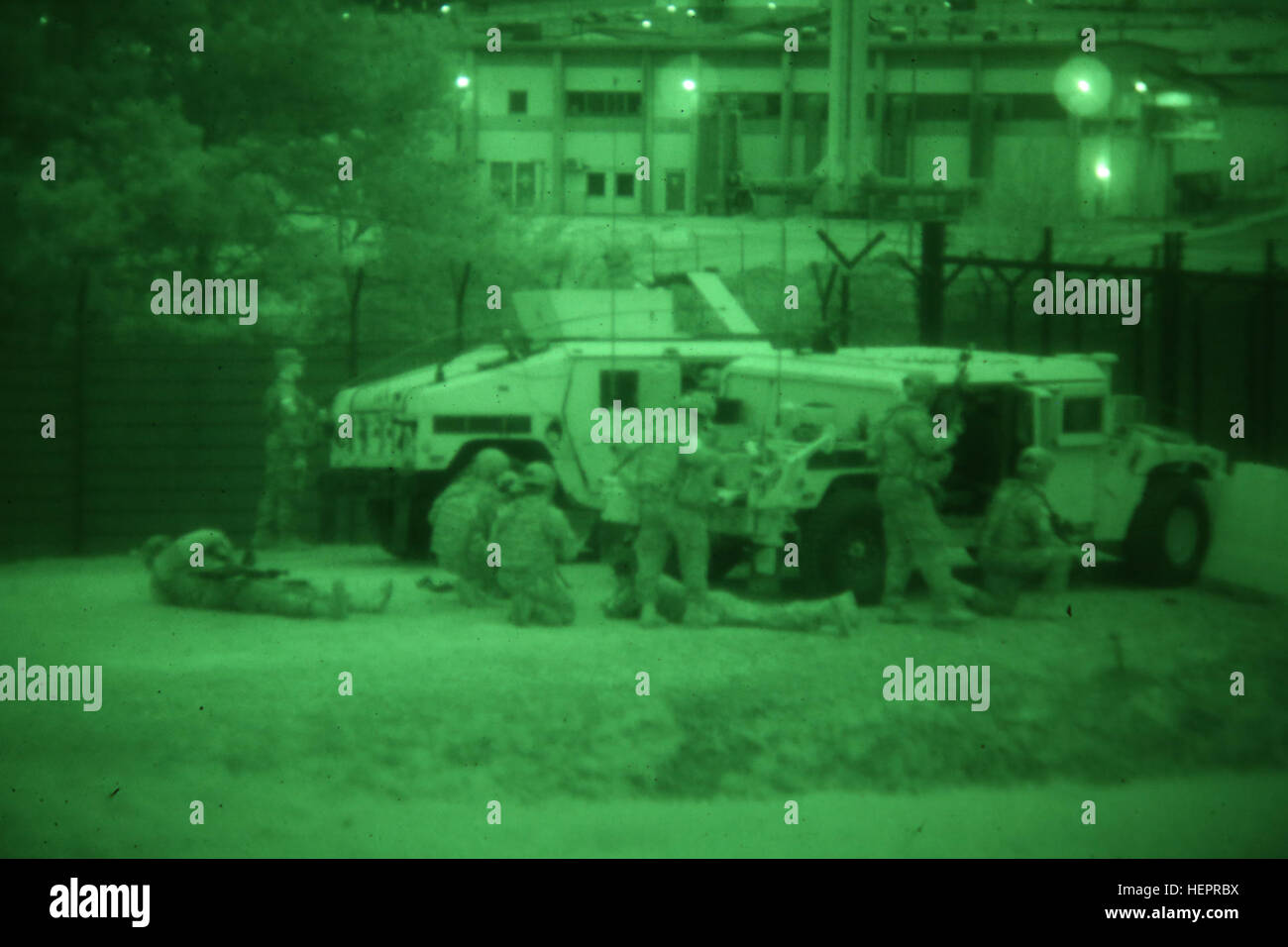 U.S. Soldiers of 3rd Battalion, 227th Aviation Regiment, 1st Air Cavalry Brigade take cover and return simulated fire while securing their entry control point during exercise Saber Junction 16 at the U.S. Army’s Joint Multinational Readiness Center (JMRC) in Hohenfels, Germany, April 19, 2016. Saber Junction 16 is the U.S. Army Europe’s 173rd Airborne Brigade’s combat training center certification exercise, taking place at the JMRC in Hohenfels, Germany, Mar. 31-Apr. 24, 2016.  The exercise is designed to evaluate the readiness of the Army’s Europe-based combat brigades to conduct unified land Stock Photo