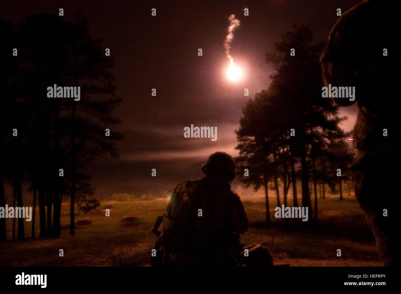 Spc. Michael Orozco of the 416th Engineering Command (Theater) engages targets during night range qualification at the 2016 U.S. Army Reserve Best Warrior Competition at Fort Bragg, N.C. May 5. This year’s Best Warrior Competition will determine the top noncommissioned officer and junior enlisted Soldier who will represent the U.S. Army Reserve in the Department of the Army Best Warrior Competition later this year at Fort A.P. Hill, Va. (U.S. Army photo by Sgt. George Thurmond II) (Released) 2016 U.S. Army Reserve Command Best Warrior 160504-A-MF249-078 Stock Photo