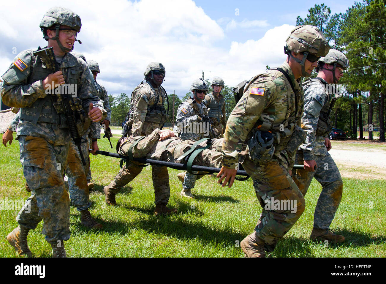 U.S. Army Paratroopers carry a simulated casualty to the evacuation