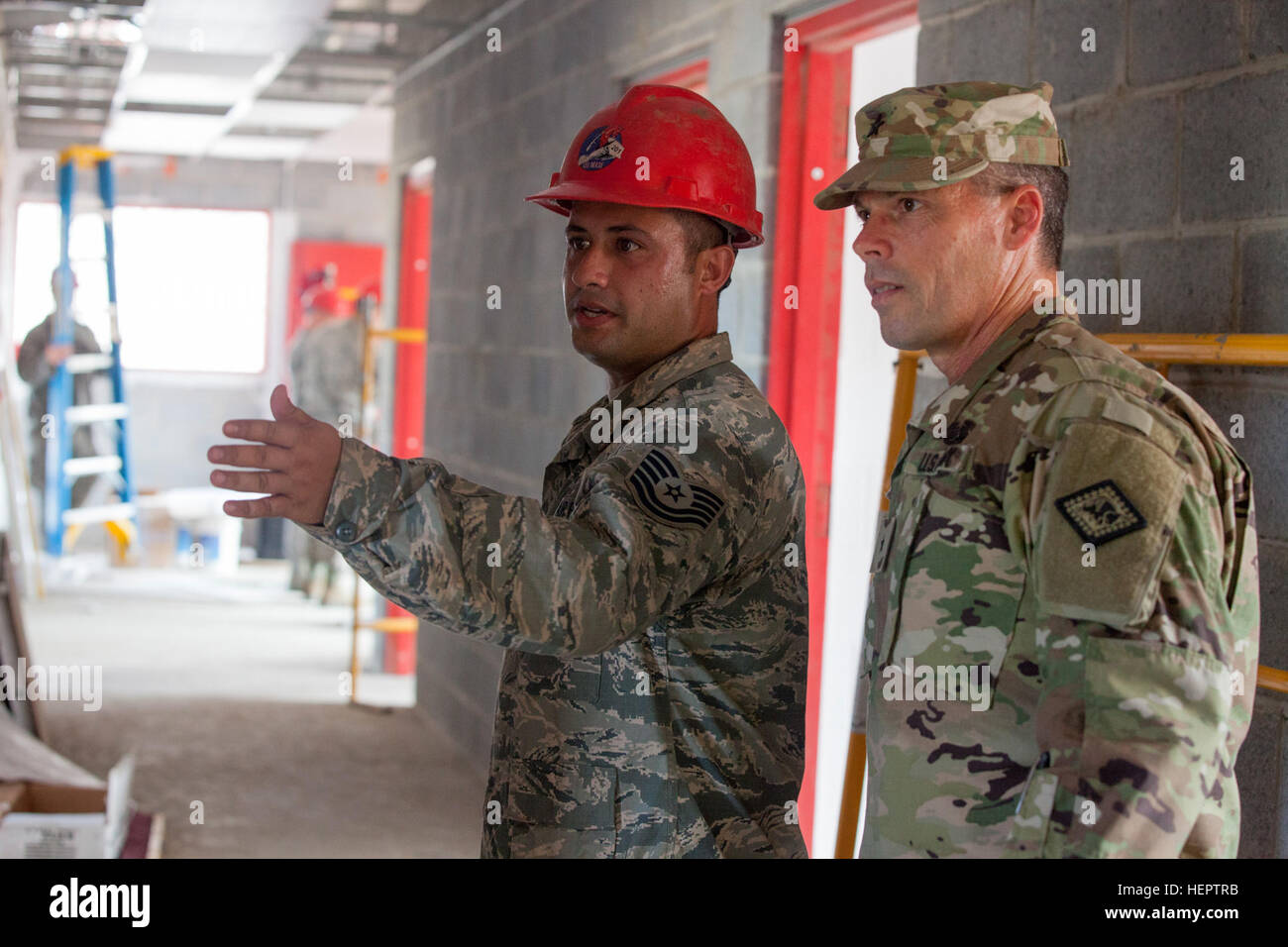 U.S Army Brig. General Gregrey Bacon of the Arkansas National Guard is briefed by U.S Air Force Tech. Sgt. Joseph Bonamico of the 201st Rapid Engineer Deployable Heavy Operational Repair Squadron Engineers on their construction progress in La Blanca, Guatemala, May 24,2016. Task Force Red Wolf and Army South conducts Humanitarian Civil Assistance Training to include tatical level construction projects and medical readiness Training Exercises providing medical access and building schools in guatemala with the Guatamalan Government and non government agencies from 05Mar16 to 18JUN16 in order to  Stock Photo
