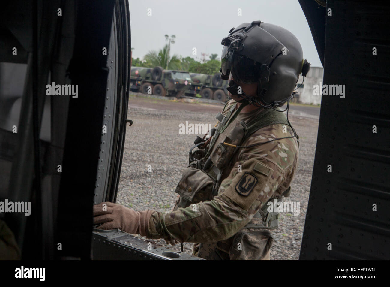 U.S. Army Sgt. John Cooney of the 238th Task Force Medical Evacuation Company, New Hampshire National Guard, prepares a UH-60 Black Hawk helicopter for take off in Coatepeque, Guatemala, May 27, 2016. Task Force Red Wolf and Army South conducts Humanitarian Civil Assistance Training to include tatical level construction projects and medical readiness Training Exercises providing medical access and building schools in guatemala with the Guatamalan Government and non government agencies from 05Mar16 to 18JUN16 in order to improve the mission readiness of US Forces and to provide a lasting benefi Stock Photo