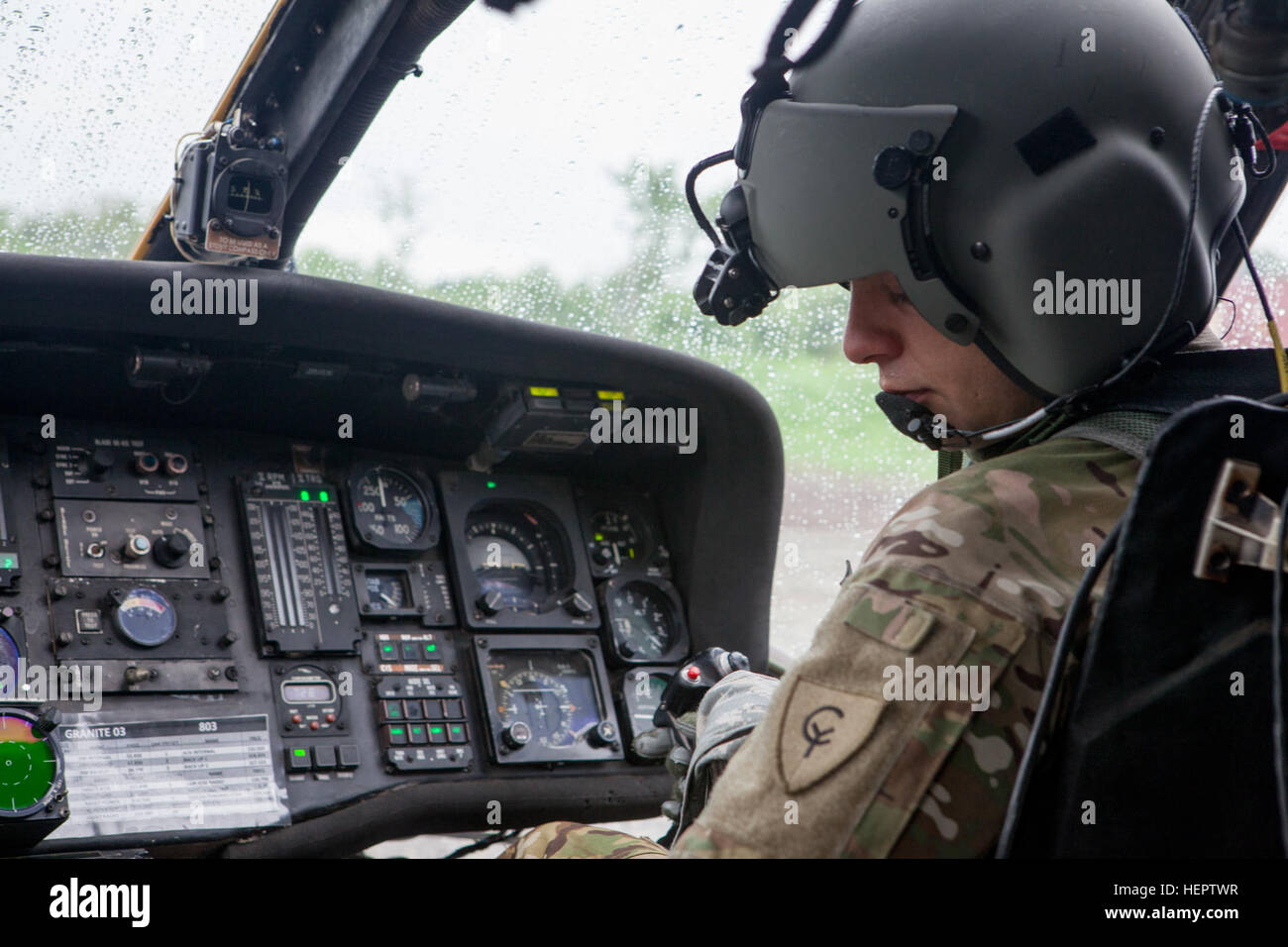 U.S. Army Warrant Officer James Eckert of the 238th Task Force Medical Evacuation Company, New Hampshire National Guard, conducts pre-flight checks on a UH-60 Black Hawk helicopter in preparation for take off in Coatepeque, Guatemala, May 27, 2016. Task Force Red Wolf and Army South conducts Humanitarian Civil Assistance Training to include tatical level construction projects and medical readiness Training Exercises providing medical access and building schools in guatemala with the Guatamalan Government and non government agencies from 05Mar16 to 18JUN16 in order to improve the mission readin Stock Photo