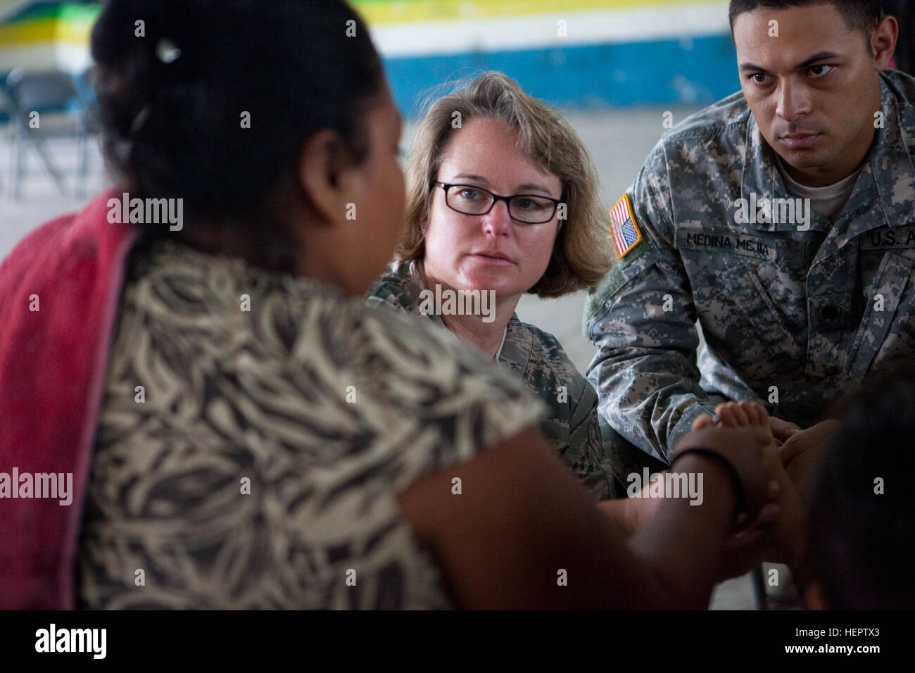 U.S. Air Force Col. Stephanie Schaefer of the 59th Medical Wing, Lackland Air Force Base, consults with a patient about a possible skin infection during a medical readiness exercise in La Blanca, Guatemala, May 28,2016. Task Force Red Wolf and Army South conducts Humanitarian Civil Assistance Training to include tatical level construction projects and medical readiness Training Exercises providing medical access and building schools in guatemala with the Guatamalan Government and non government agencies from 05Mar16 to 18JUN16 in order to improve the mission readiness of US Forces and to provi Stock Photo