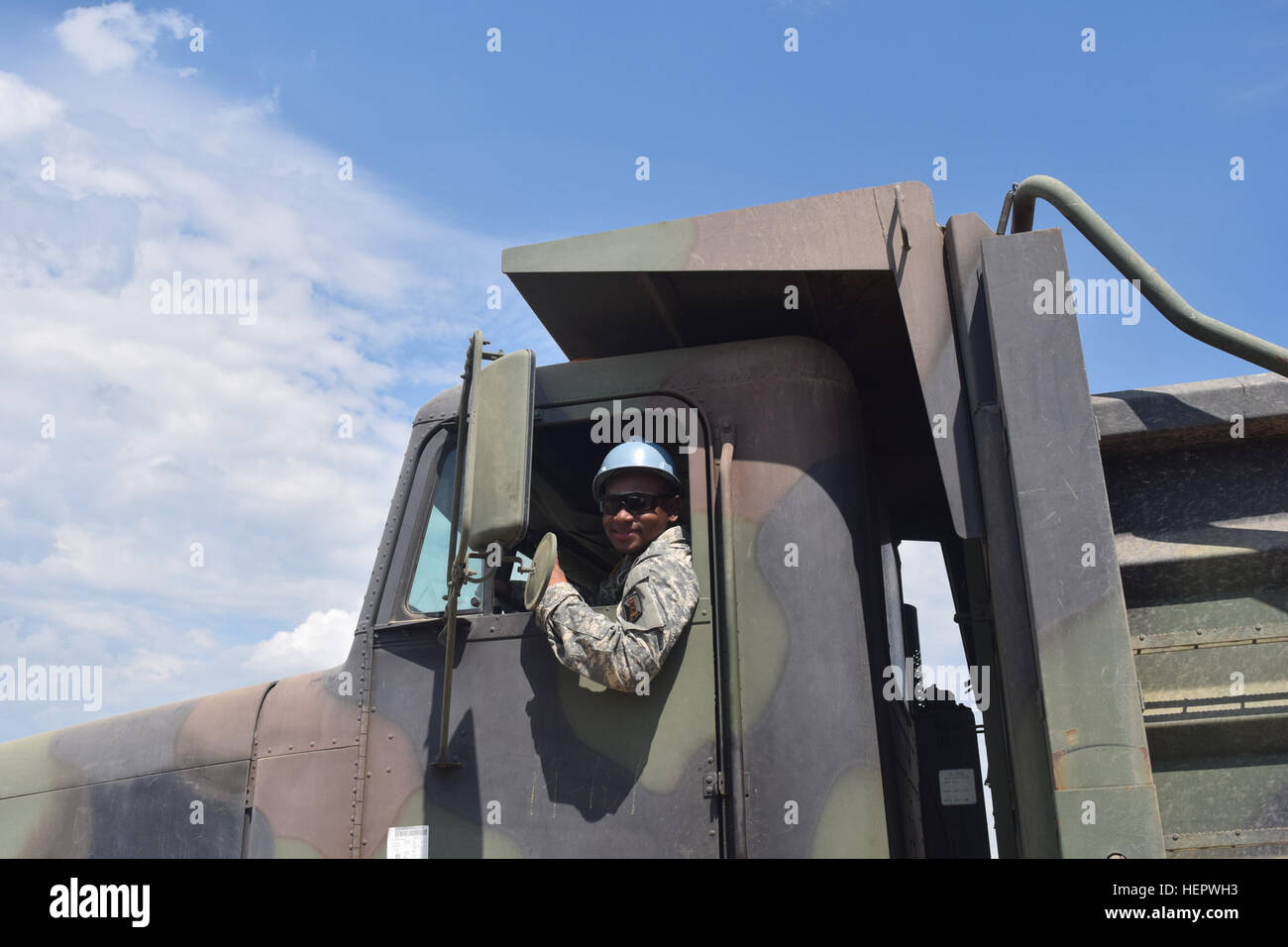 Specialist Kentona Shipp, an engineer with the 858th Horizontal Engineer Company, 223rd Engineer Battalion, 168th Engineer Brigade, Mississippi Army National Guard moves construction material with a dump truck on June 12, 2016 during Operation Resolute Castle at Novo Selo Training Area, Bulgaria.  Once complete, the ammunition holding area will allow larger units to conduct training operations in Bulgaria.  During Resolute Castle, Engineer Brigades from both the Mississippi and Tennessee Army National Guard are teaming up to improve military infrastructure in Bulgaria as part of United States  Stock Photo