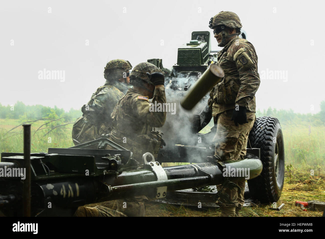 U.S Army Soldiers of Alpha Co. 319th Field Artillery fire a M198 howitzer during Anakonda 2016