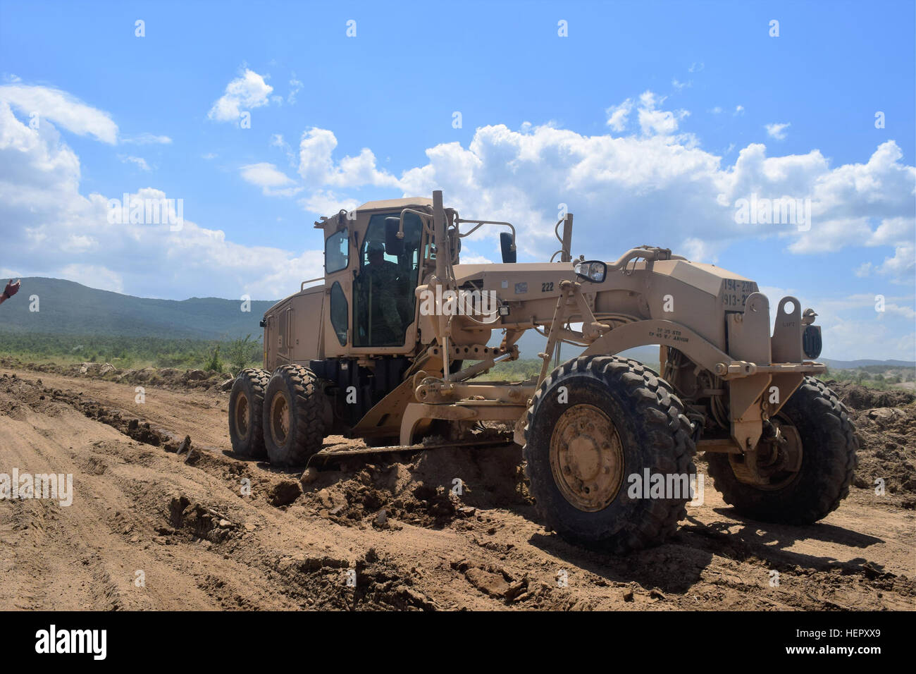 Soldiers with the 168th Engineer Brigade, Mississippi Army National Guard use heavy construction equipment to extend a tank firing range and build an ammunition holding area at Novo Selo Training Area, Bulgaria, June 25, 2016 during Operation Resolute Castle.  Increasing the military infrastructure on this base will enable it to host large-scale training operations for years to come.  (1st Lt. Matthew Gilbert, 194th Engineer Brigade, Tennessee Army National Guard) Mississippi Army National Guard Participates in Military Construction in Bulgaria 160625-A-CS119-007 Stock Photo