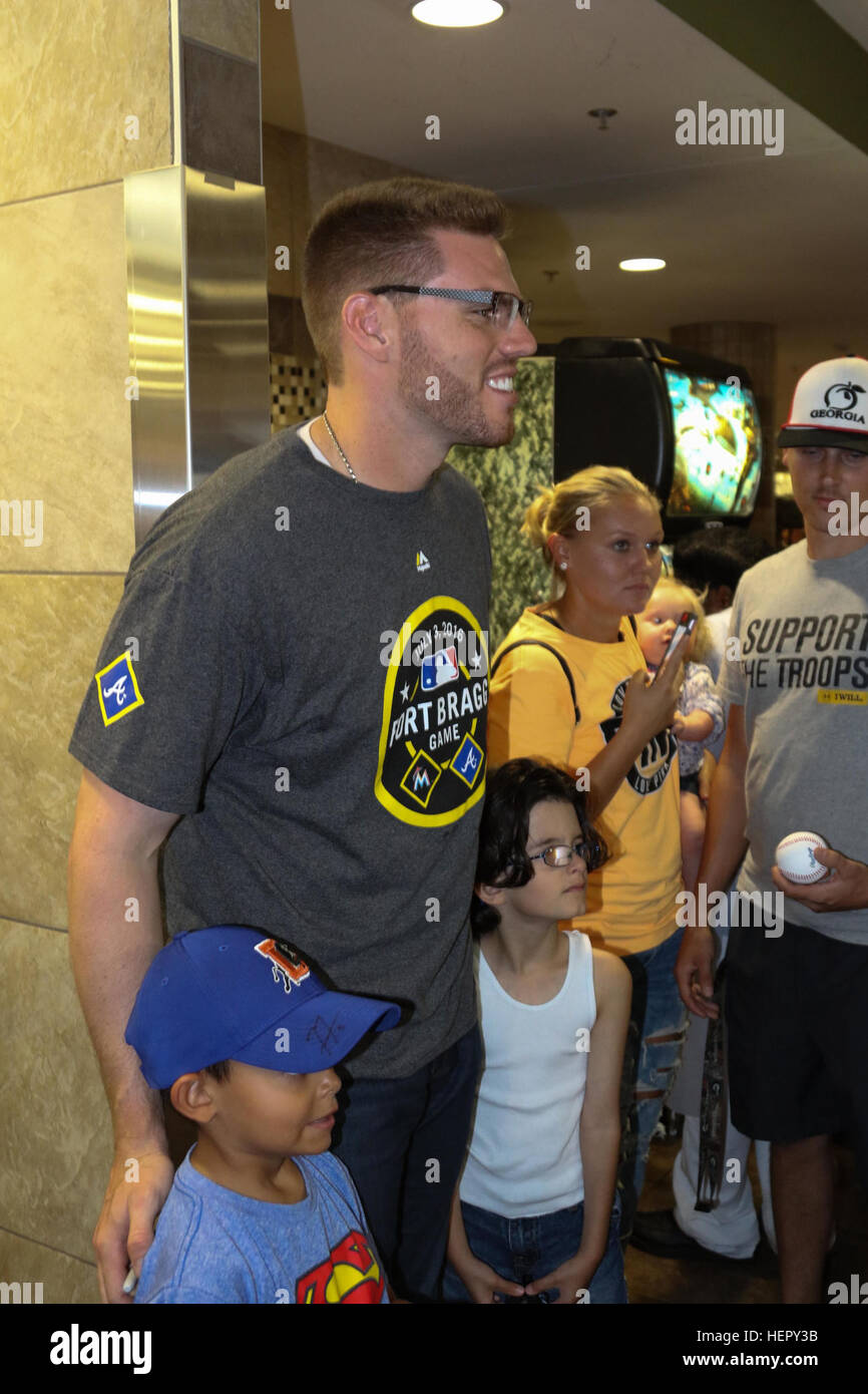 Jeff Francoeur, a player for the Atlanta Braves signs an autograph for a  military family member during a luncheon at Fort Bragg, N.C., July 3, 2016.  The event is a part of