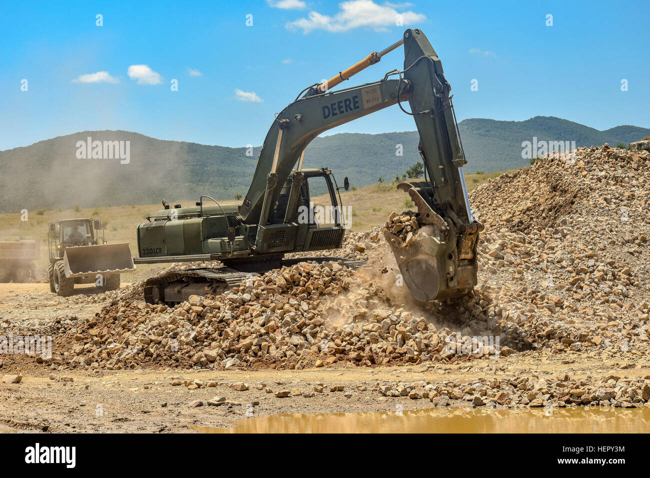 A hydraulic excavator operated by military engineers from the 841st