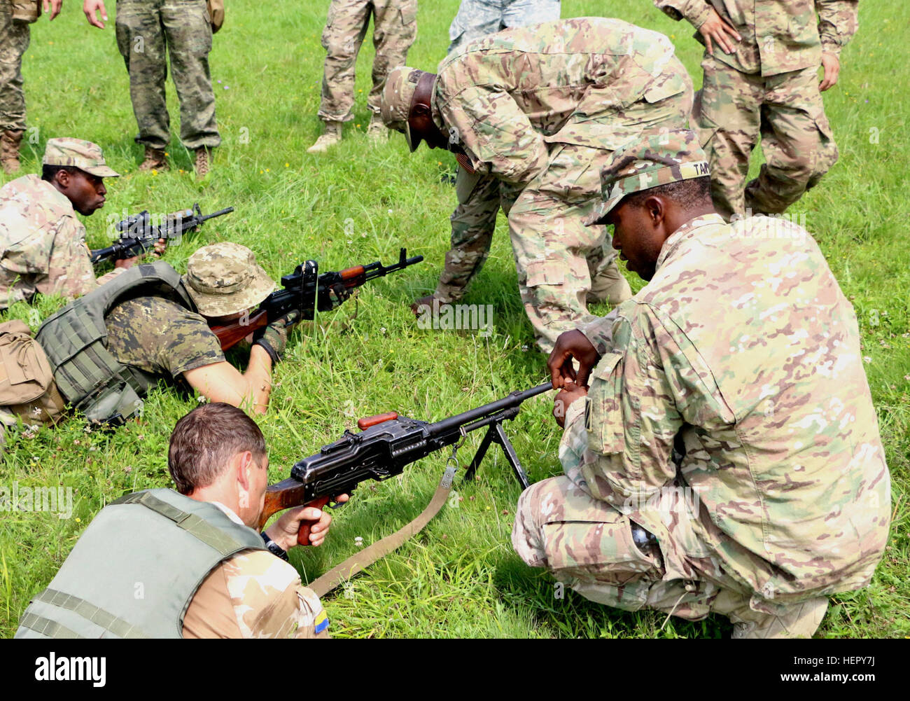 YAVORIV, Ukraine - Soldiers of 6th Squadron, 8th Cavalry Regiment, 2nd  Infantry Brigade Combat Team, 3rd Infantry Division train Ukrainian Soldiers on  trigger squeeze, July 27, 2016. Trigger squeeze is one of the fundamentals of rifle  marksmanship. Soldiers of 6-8 Cav are here in support of the Joint Multinational  Training Group-Ukraine. JMTG-U is responsible for training Ukrainian land forces  and building a team of Ukrainian cadre who will ultimately assume that  responsibility. The training is designed to reinforce defensive skills of the  Ukrainian Ground Forces in order to increase th Stock Photo
