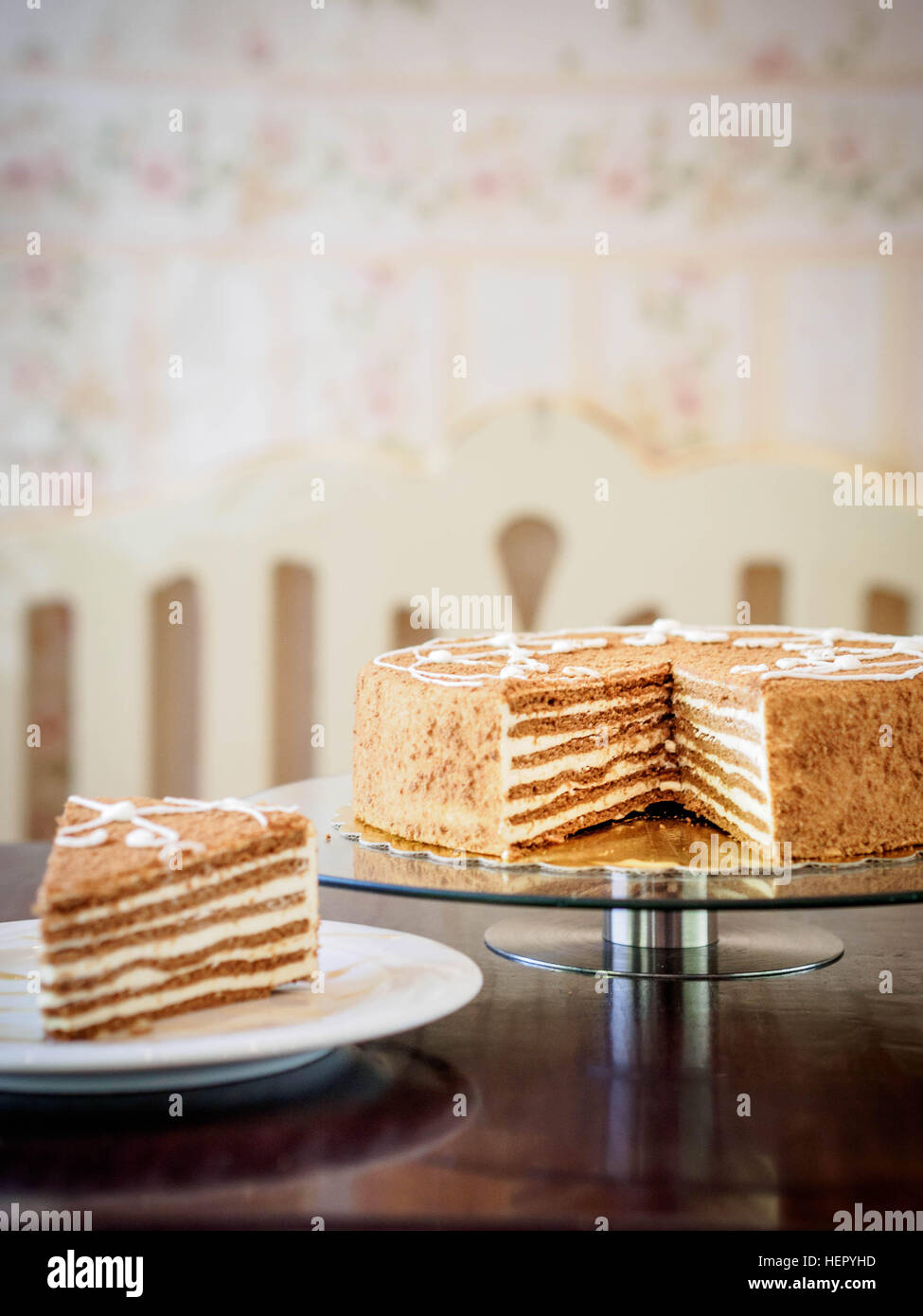 Slice of French layer cake and serving of cake Stock Photo