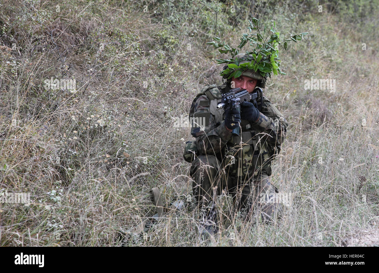 A Polish soldier of 2nd Battalion, 17th Mechanized Brigade provides security while conducting defensive operations during exercise Combined Resolve VII at the U.S. Army’s Joint Multinational Readiness Center in Hohenfels Germany, Sept. 11, 2016. Combined Resolve VII is a 7th Army Training Command, U.S. Army Europe-directed exercise, taking place at the Grafenwoehr and Hohenfels Training Areas, Aug. 8 to Sept. 15, 2016. The exercise is designed to train the Army’s regionally allocated forces to the U.S. European Command. Combined Resolve VII includes more than 3,500 participants from 16 NATO an Stock Photo