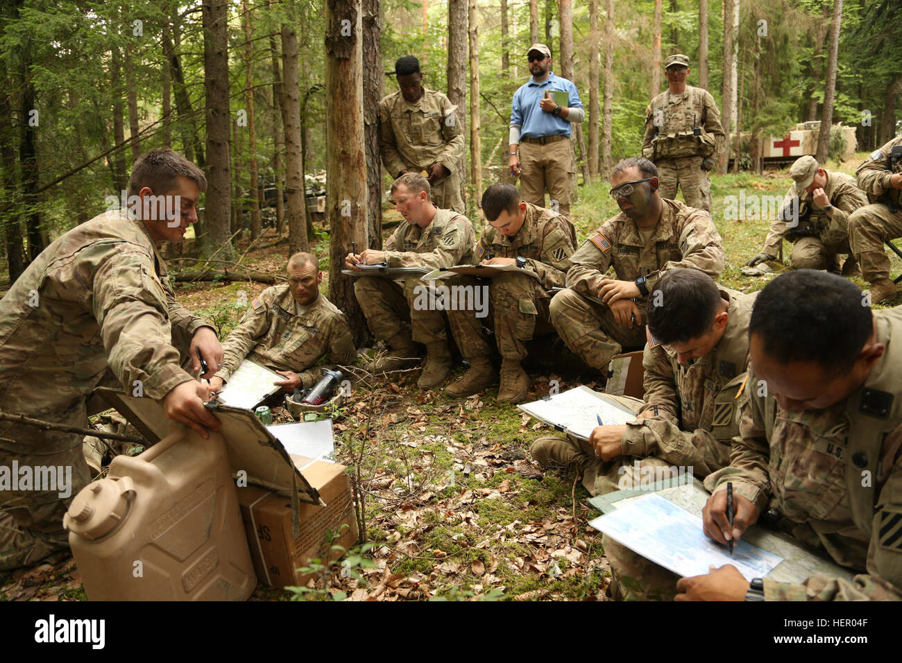 U.S. Soldiers of Rider Company, 2nd Battalion, 7th Infantry Regiment, 1st Armored Brigade record information while conducting a brief during exercise Combined Resolve VII at the U.S. Army’s Joint Multinational Readiness Center in Hohenfels Germany, Sept. 11, 2016. Combined Resolve VII is a 7th Army Training Command, U.S. Army Europe-directed exercise, taking place at the Grafenwoehr and Hohenfels Training Areas, Aug. 8 to Sept. 15, 2016. The exercise is designed to train the Army’s regionally allocated forces to the U.S. European Command. Combined Resolve VII includes more than 3,500 participa Stock Photo