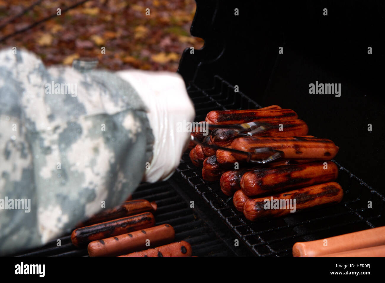 Hot dogs cook on the grill for Family Readiness Group’s charity lunch