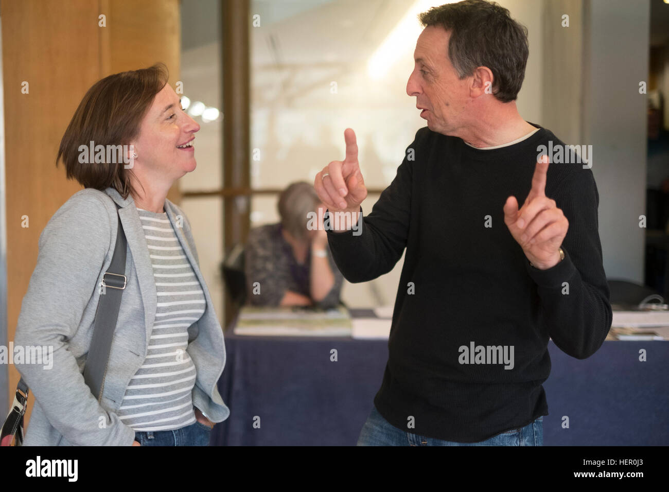 Sophe Batterbury (L), picture editor of The I newspaper, speaking with photojournailst Nick Treharne (R)The Eye Festival of Documentary photography, Aberystwyth Arts Centre, Wales UK, 2016 Stock Photo