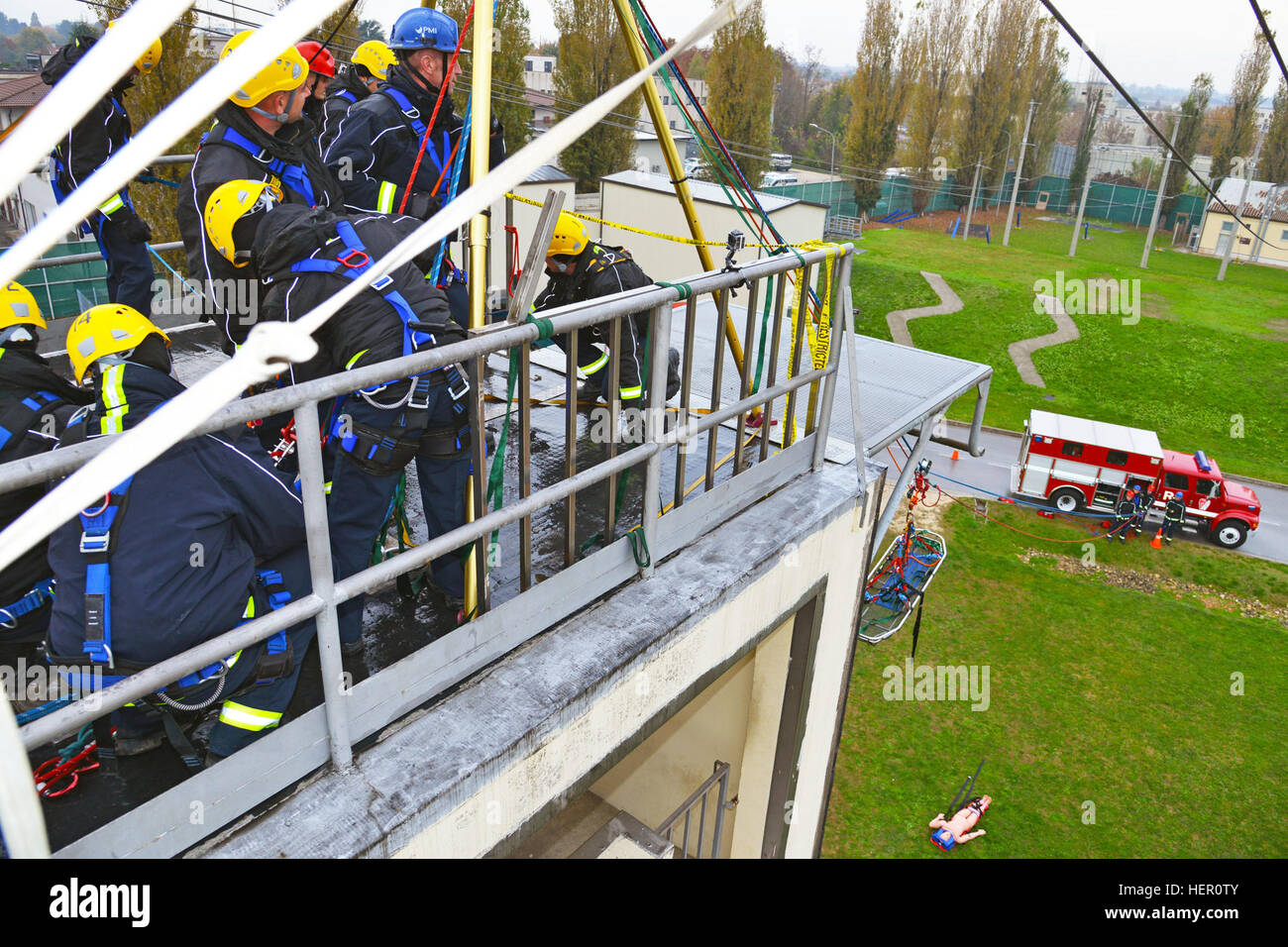 Firefighters assigned to the U.S. Army Garrison Italy, use rope work ...