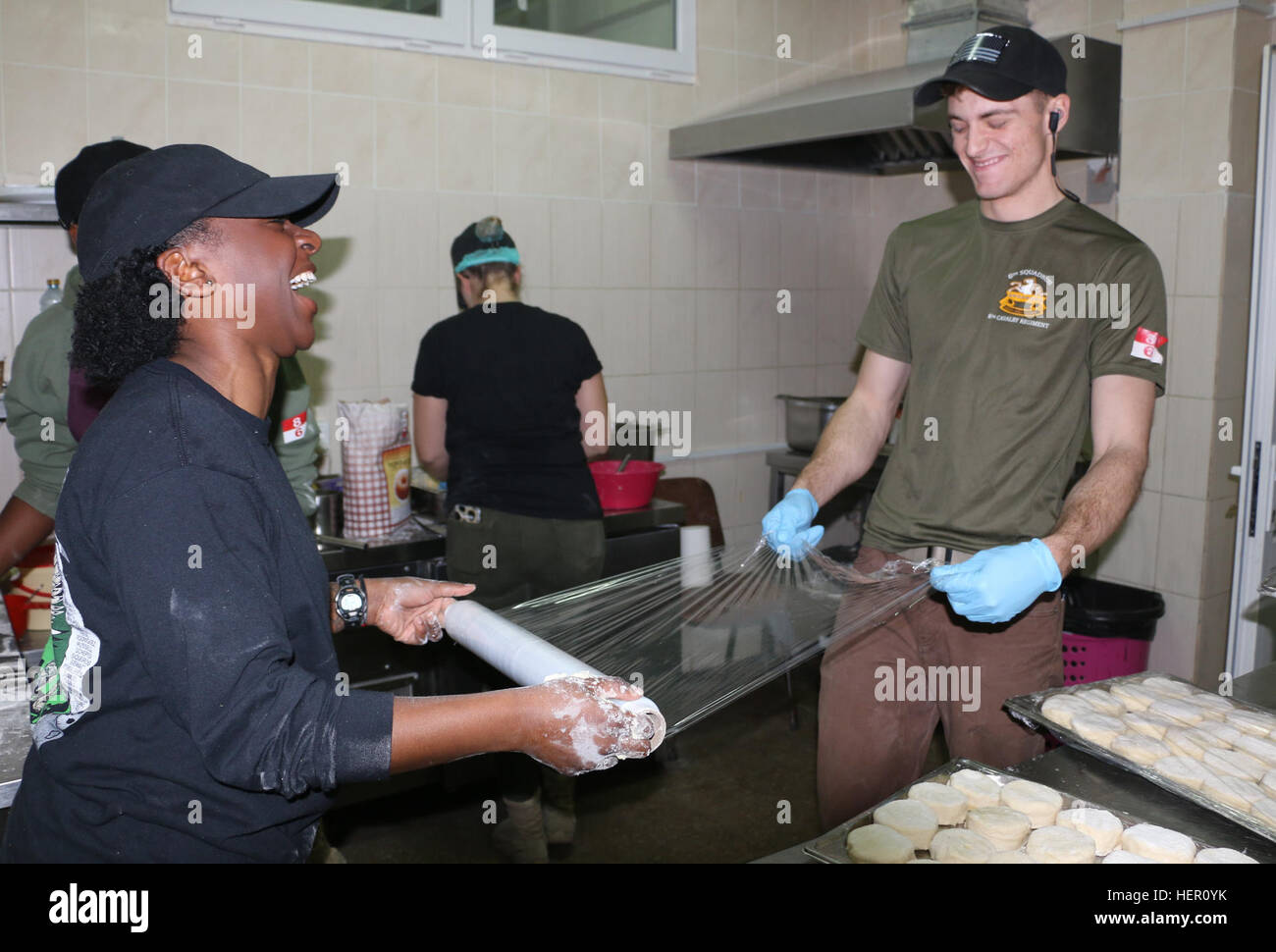 YAVORIV, Ukraine - Soldiers of 6th Squadron, 8th Cavalry Regiment, 2nd Infantry Brigade Combat Team, 3rd Infantry Division prepare to wrap biscuits during Thanksgiving food preparation here, November 24, 2016. Mustang Soldiers organized a plan to ensure the preparation was successful for Thanksgiving celebration. 6-8 CAV is deployed in support of Joint Multinational Training Group-Ukraine whose mission focuses on building a sustainable and enduring training capacity and capability within the Ukrainian land forces. (U.S.Army photo by Spc. John Onuoha / Released) Mustangs celebrate Thanksgivi Stock Photo