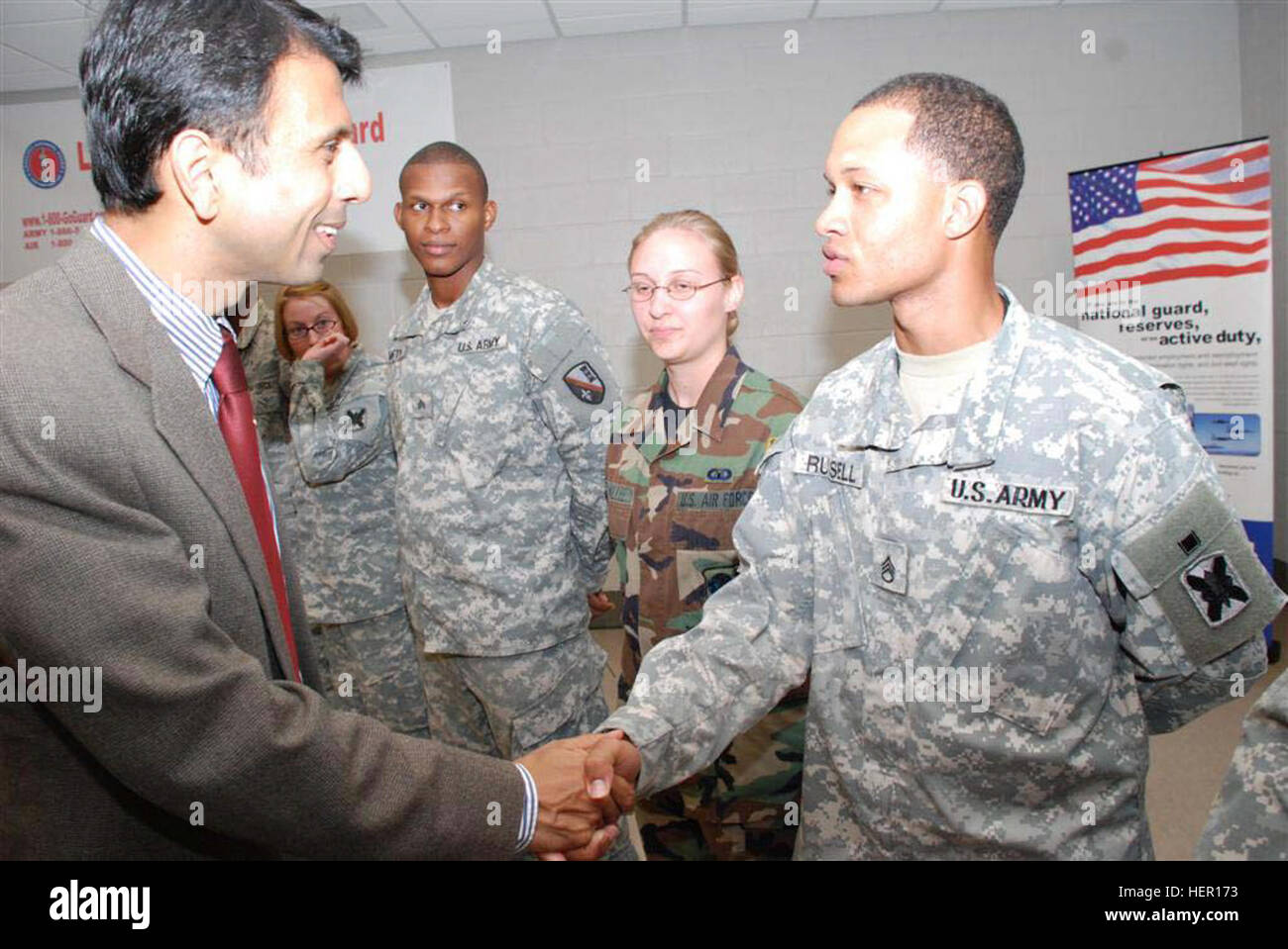 ALEXANDRIA, La. - Governor Bobby Jindal makes his way through a crowd of Soldiers to shake hands and thank them for their service.  Jindal arrived at Camp Beauregard, La., on Oct 14 to sign the Five Star Statement of Support, pledging his loyalty as an employer.  (U.S. Army Photo by Sgt. Tresa L. Allemang, 199th Brigade Support Battalion Unit Public Affairs Representative) Bobby Jindal Camp Beauregard 2 Stock Photo