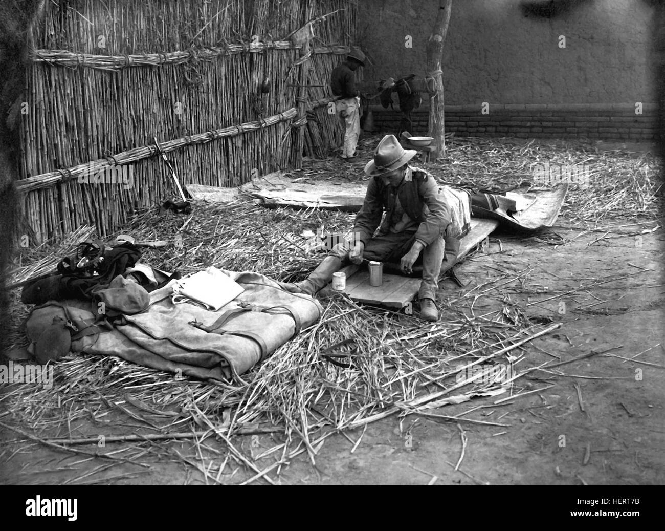 Typical sleeping quarters of an officer in China.  Photo of Lieut.  (now Captain) Stamford after the battle of Yang SIng.  Ca.  1900.  (Army) Exact Date Shot Unknown NARA FILE #:  111-RB-3688 WAR & CONFLICT BOOK #:  329 US military quarters during Boxer Rebellion HD-SN-99-01988 Stock Photo