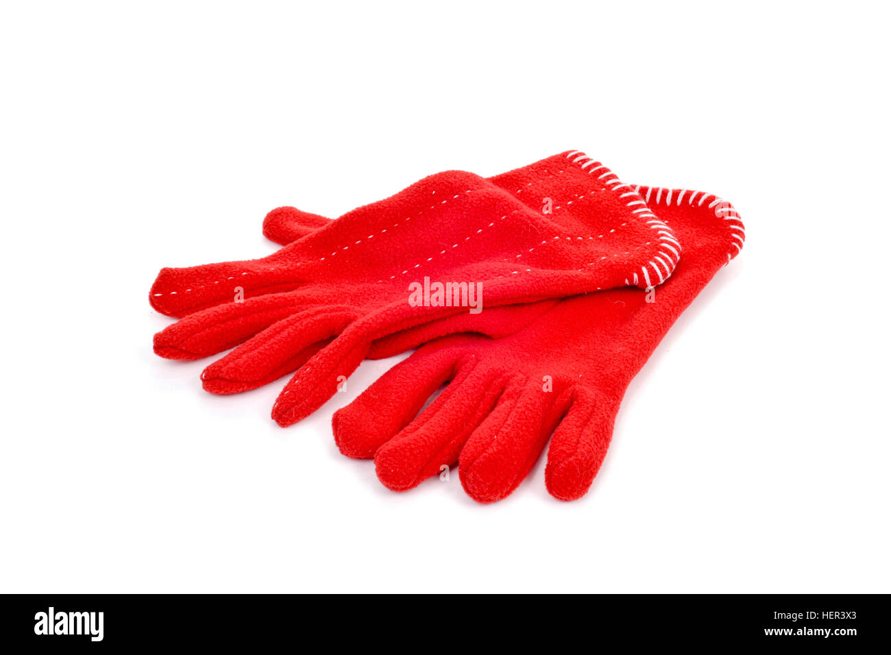 a pair of warming red fleece gloves on a white background Stock Photo