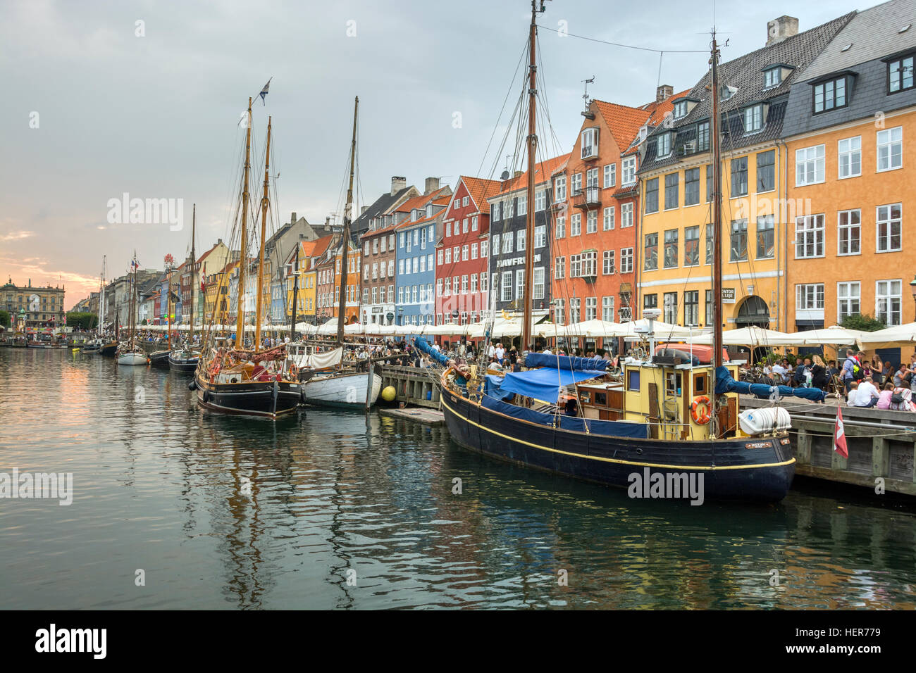 Coloured buildings and tall wooden ships in Nyhavn, Copenhagen Stock Photo