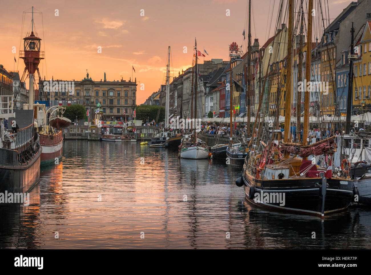 Coloured buildings and tall wooden ships in Nyhavn, Copenhagen Stock Photo