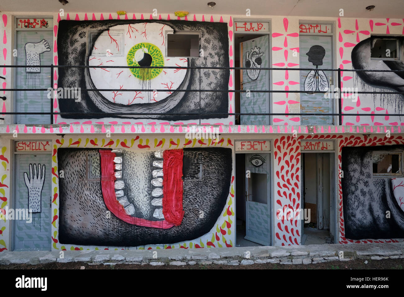 Hotel,abandoned,graffiti,mural,art,painting,eye,mouth,hand,letters,smelly,funny,humour,human organs,body,door,open Stock Photo