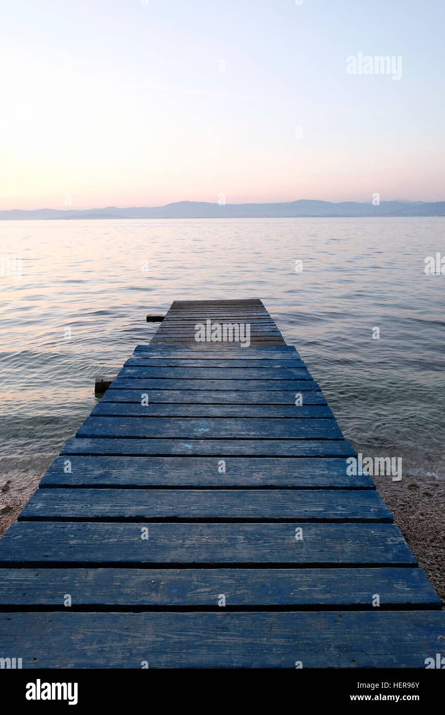 absence,Adriatic,beach,blue,board walk,dusk,horizon,Island,jetty,Mediterranean,pier,sea,sunset,walk,water,wood Stock Photo