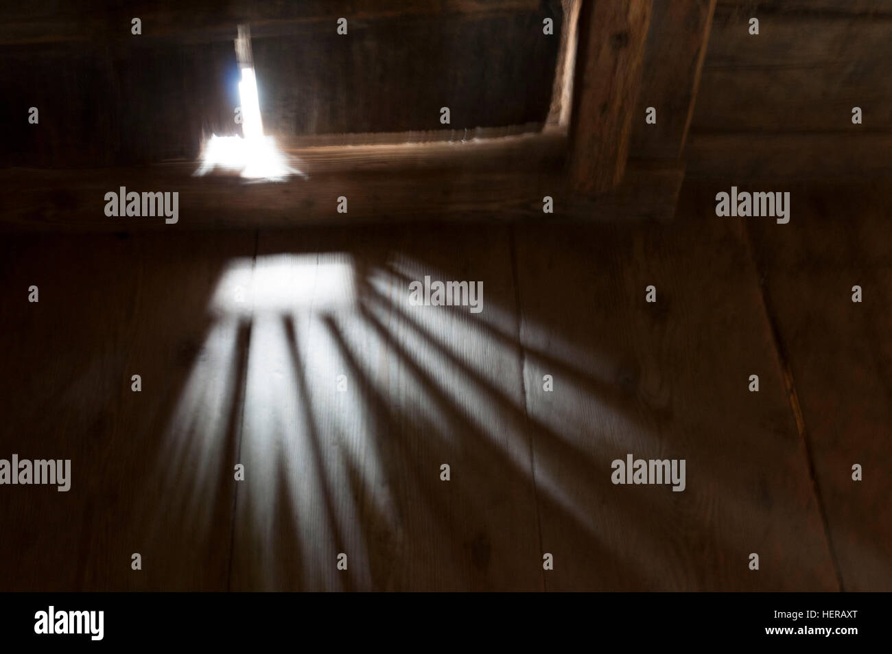 Light is falling through a door crack Stock Photo