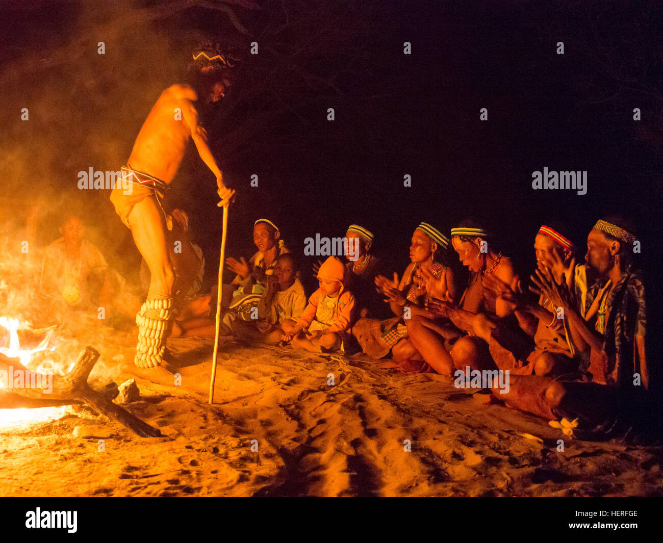 Bushmen, ritual dance around fire, Kalahari Desert, Botswana Stock Photo