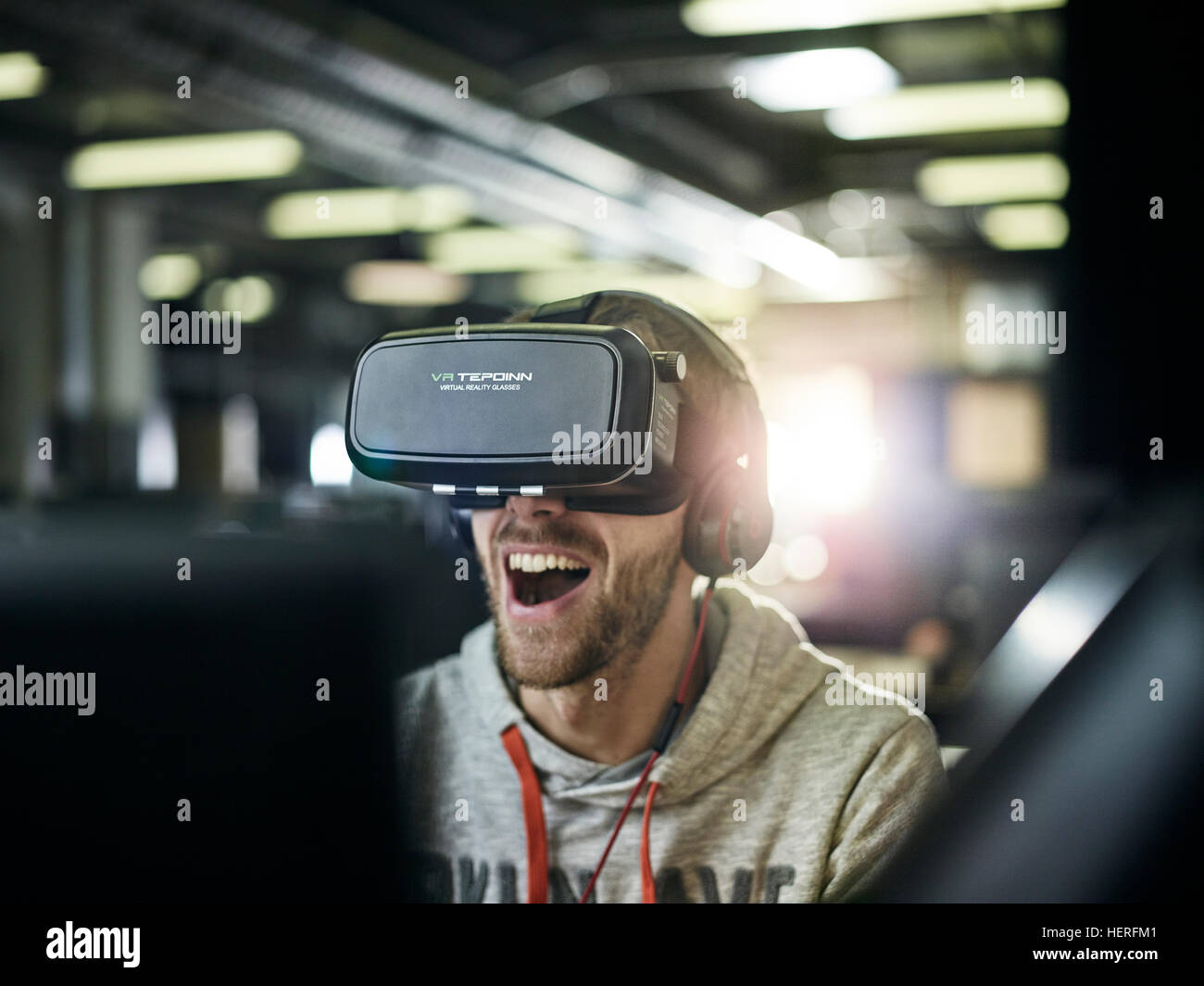 Man with VR goggles, virtual reality glasses and headphones Stock Photo