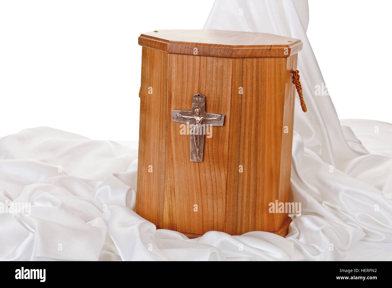 Wooden urn placed on white velvet Stock Photo Alamy