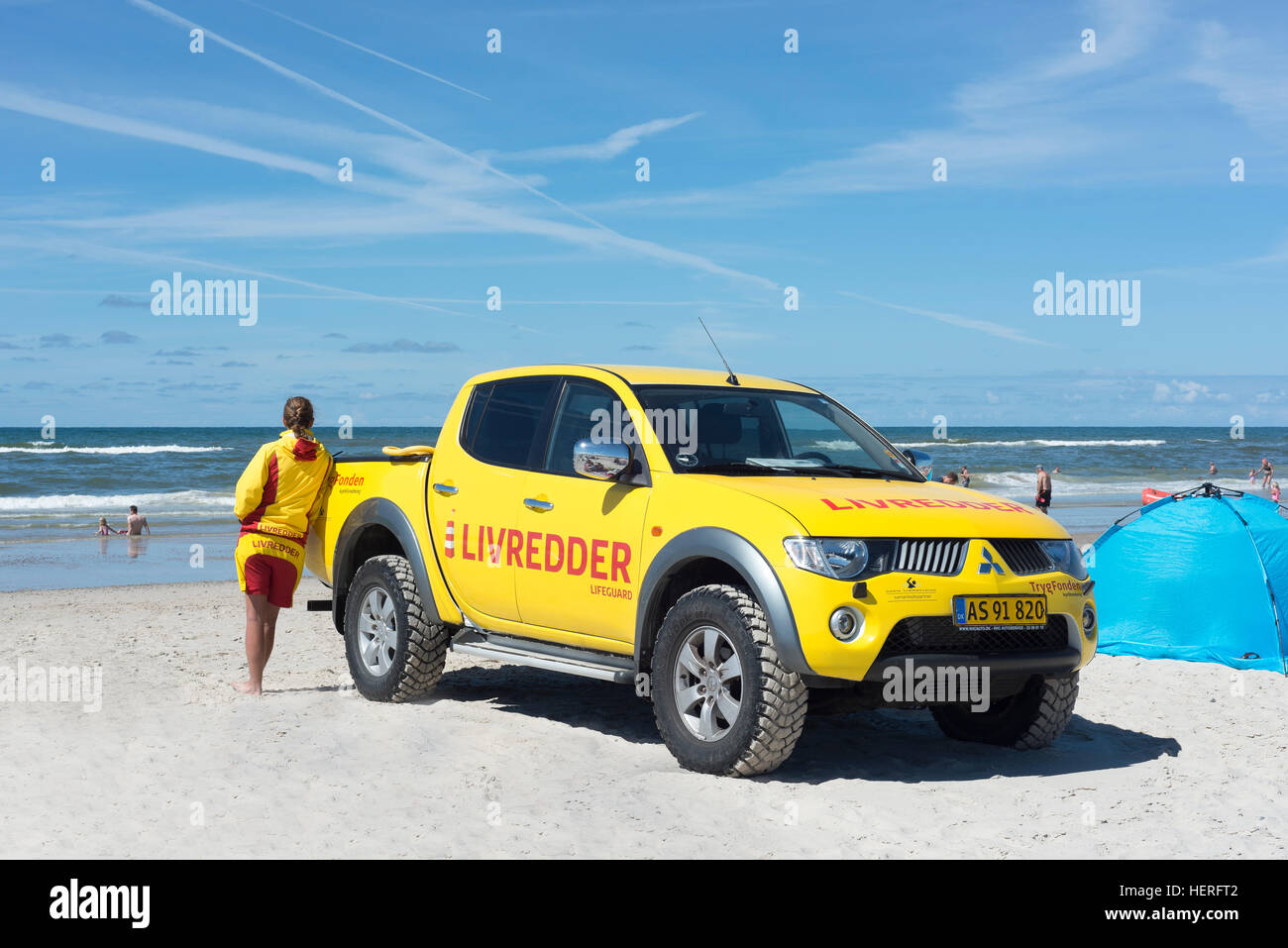 Yellow car with inscription Livredder on Henne Beach, water rescue service in use, Henne, Southern Denmark, The North Sea Stock Photo