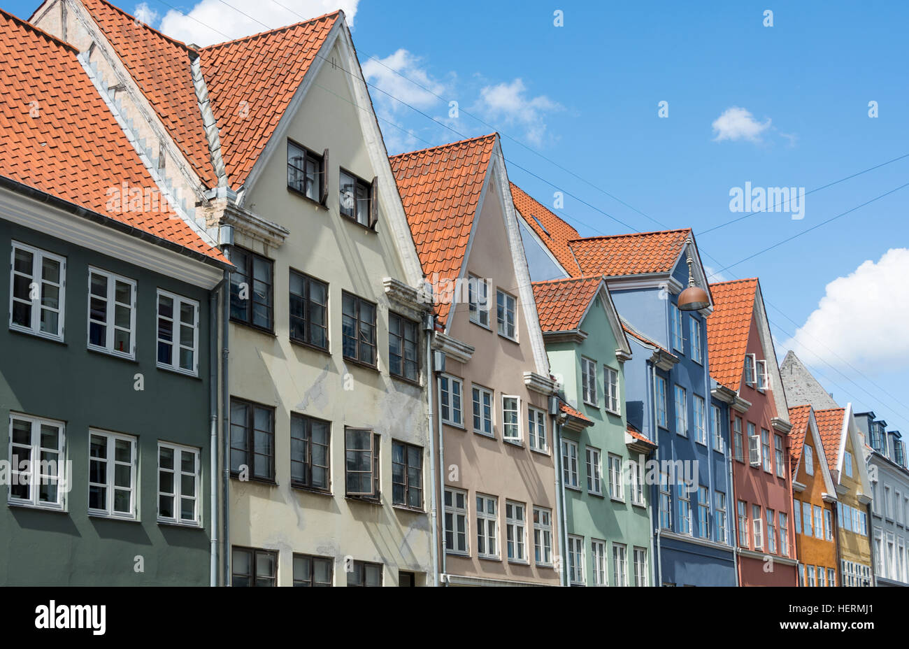 Colourfully painted houses on a street in central Copenhagen Stock Photo